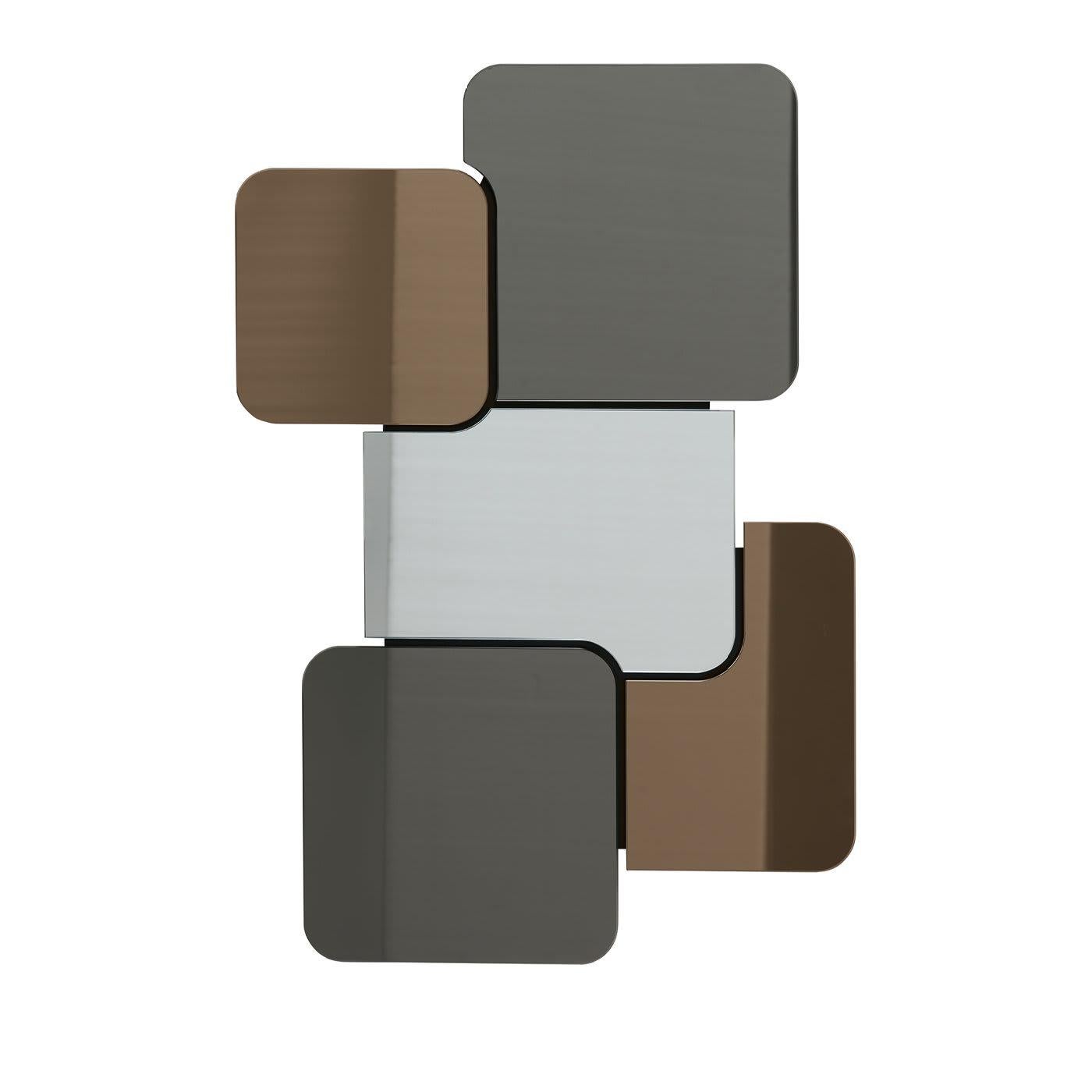 A chic contemporary addition to an entryway or hall, the Domino Wall Mirror can be hung either vertically or horizontally. Featuring pieces of glass with rounded corners in shades of bronze, silver and gunsmoke, the mirror is pure style. Perfect