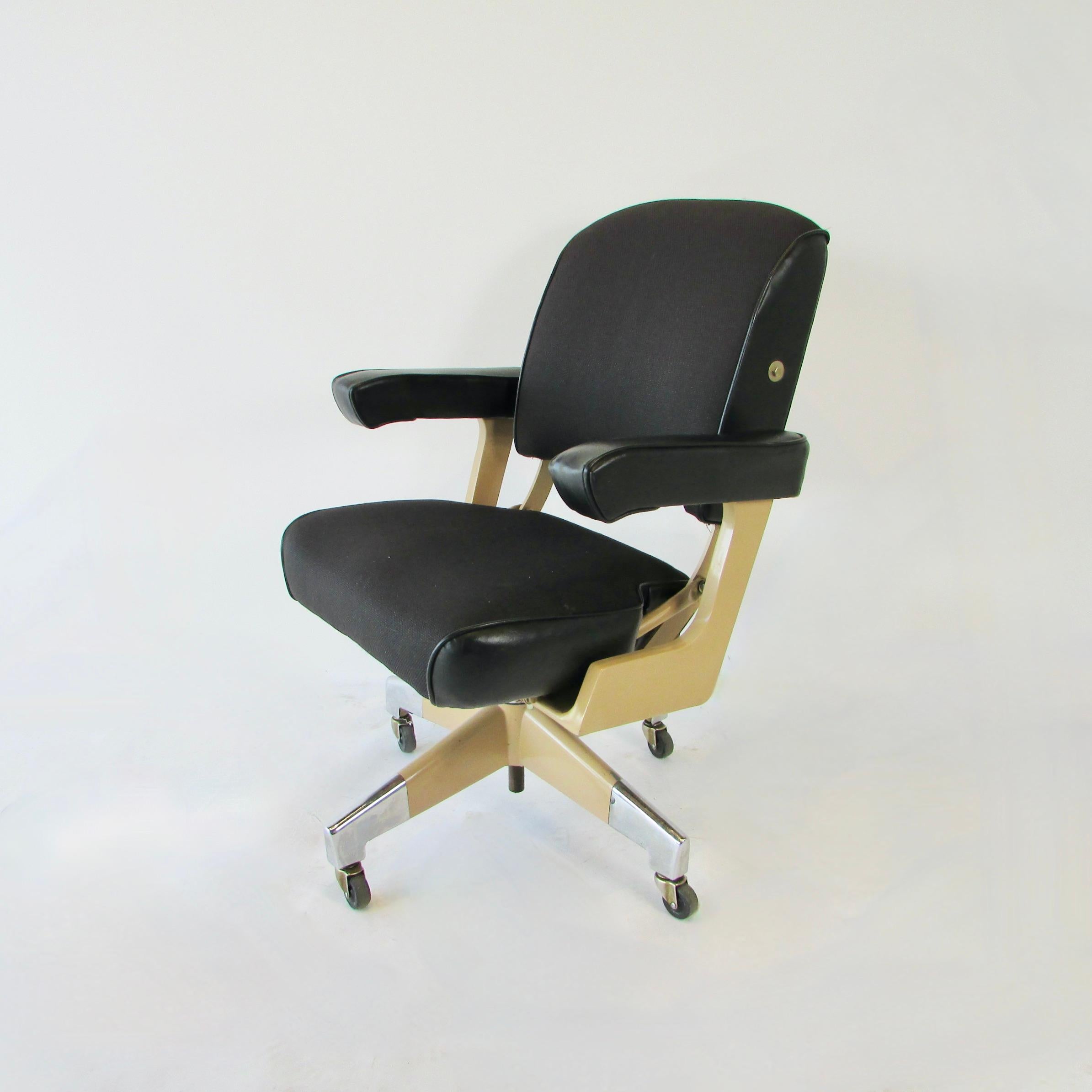 Durable quality construction would be one way to describe this Domore Chair co. swivel desk chair. Heavy duty everything. Nuts bolts frame upholstery. Multi adjustable arms slide in or out. Seat pad adjusts forward and back. Backrest does recline by