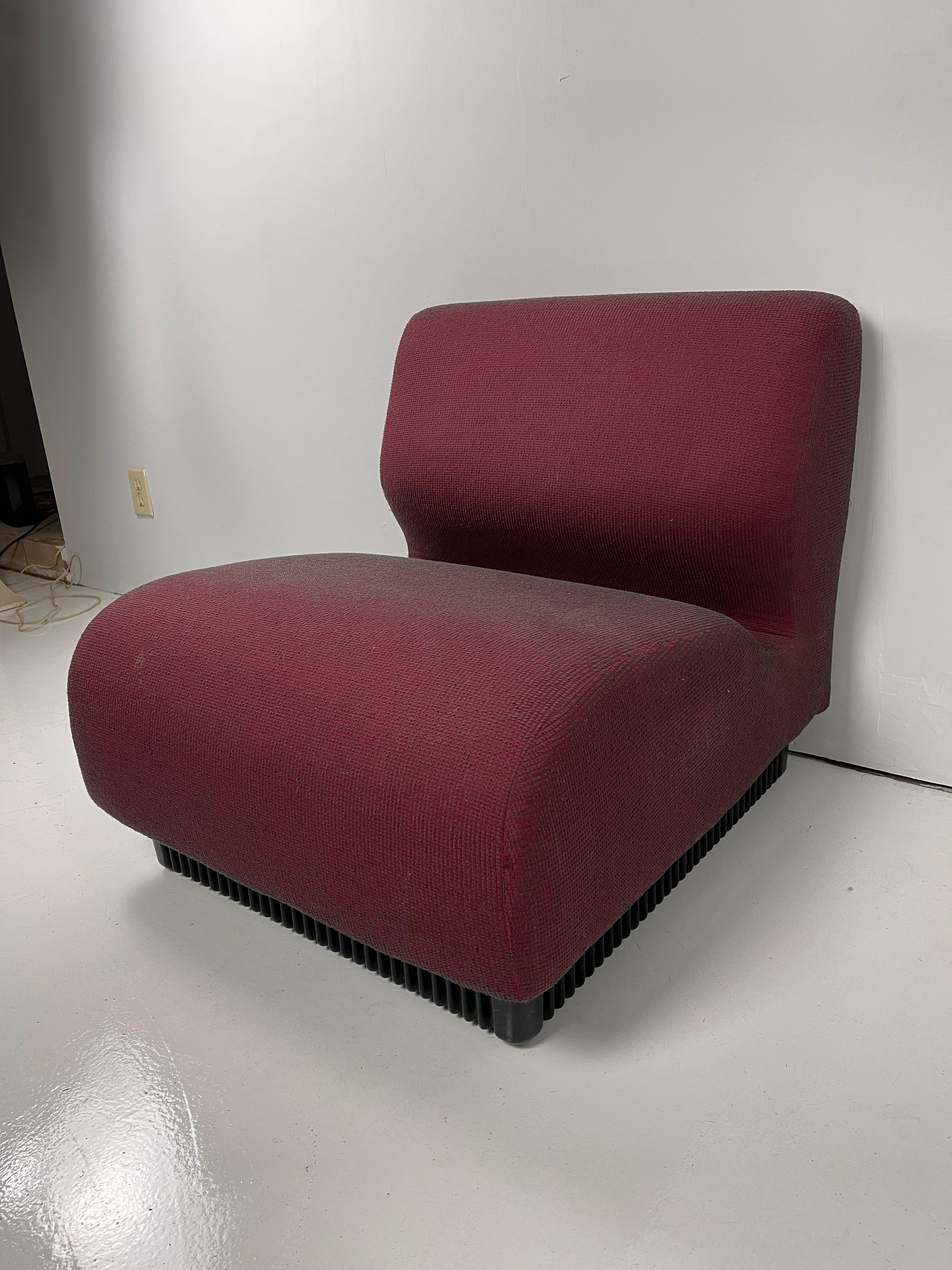 Modular slipper chairs with molded plastic base in a burgundy wool blend upholstery.