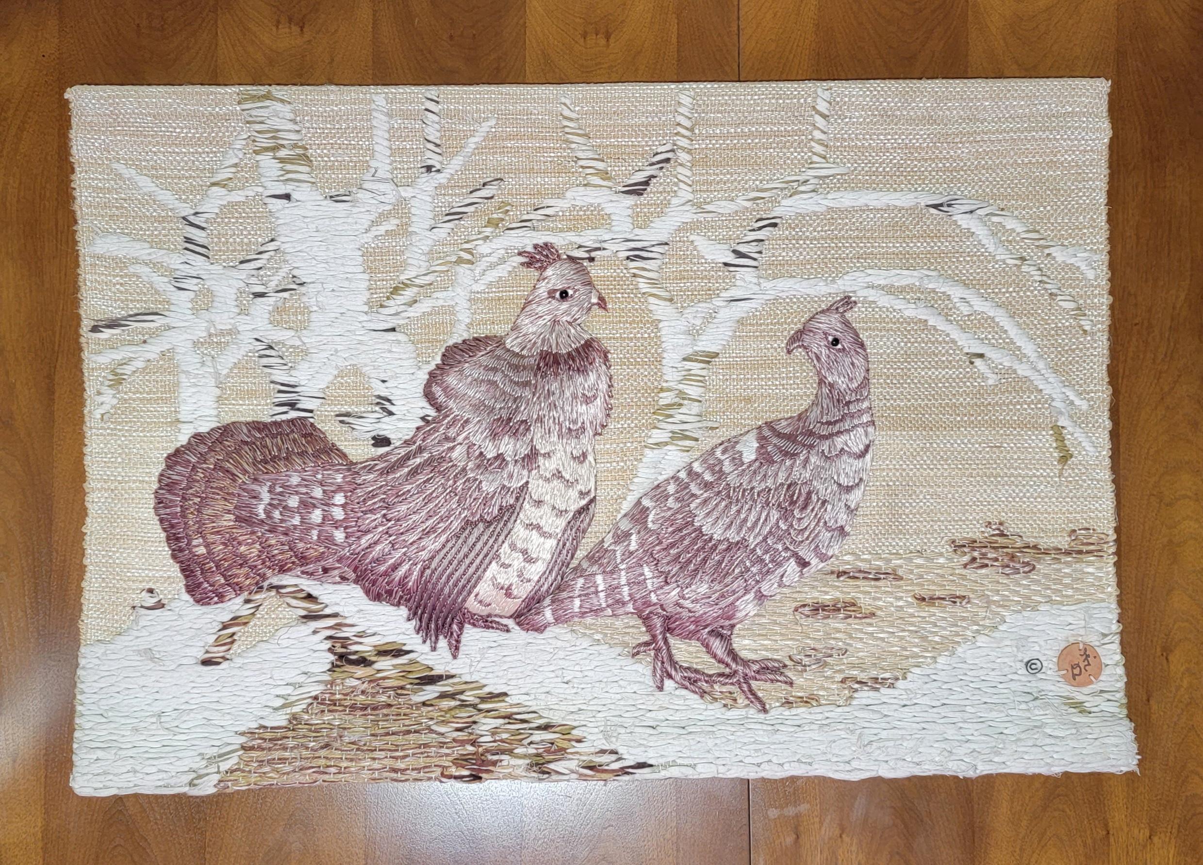 Woven textile wall art by Don Freedman. Highly textured bird motif textile that appears to Pheasant or Grouse with trees in background. Signed lower right corner. Retains cloth label verso. Measures 38