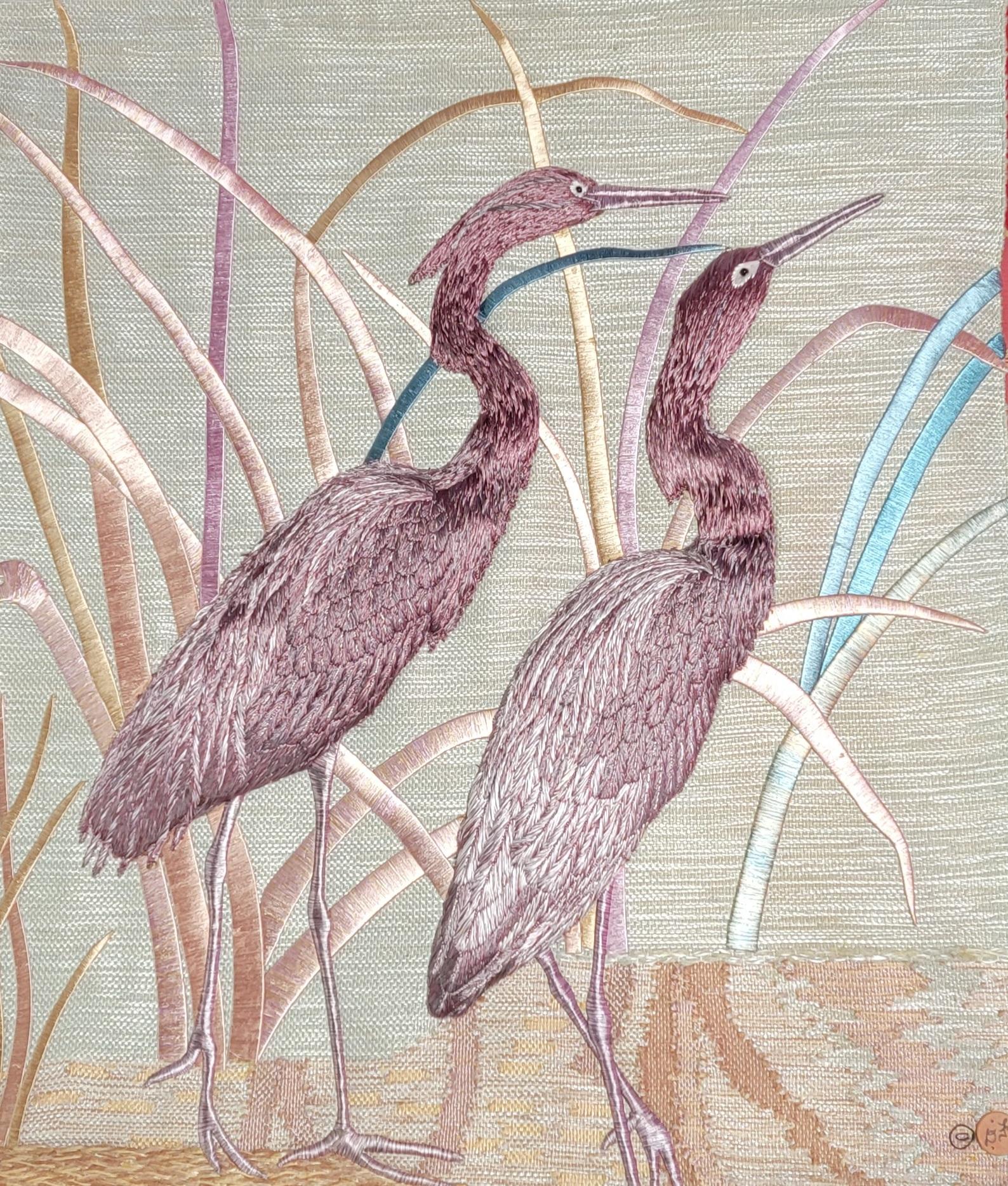 Woven textile wall art by Don Freedman. Highly textured bird motif textile featuring two Heron's in the marsh with tule in background. Signed lower right corner. Retains cloth label verso. Large-scale measures 44