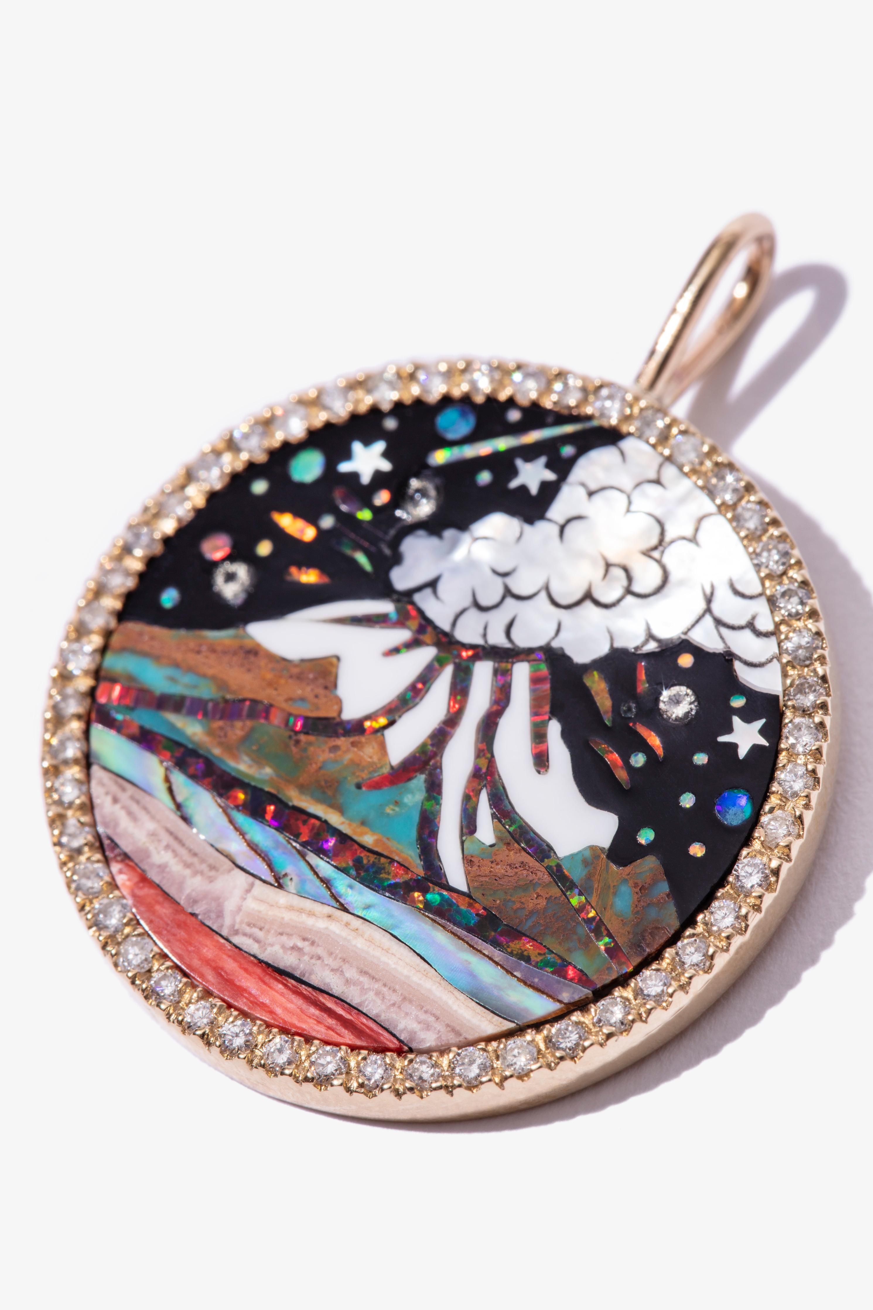 A vibrant, eye catching medallion inspired by our fascination with El Popocatépetl Volcano and Mexican Artist Dr Atl´s work.

Navajo work inlay gemstones, cast in 14-karat gold, set with shimmering white diamonds.

Made by hand at our Mexico City
