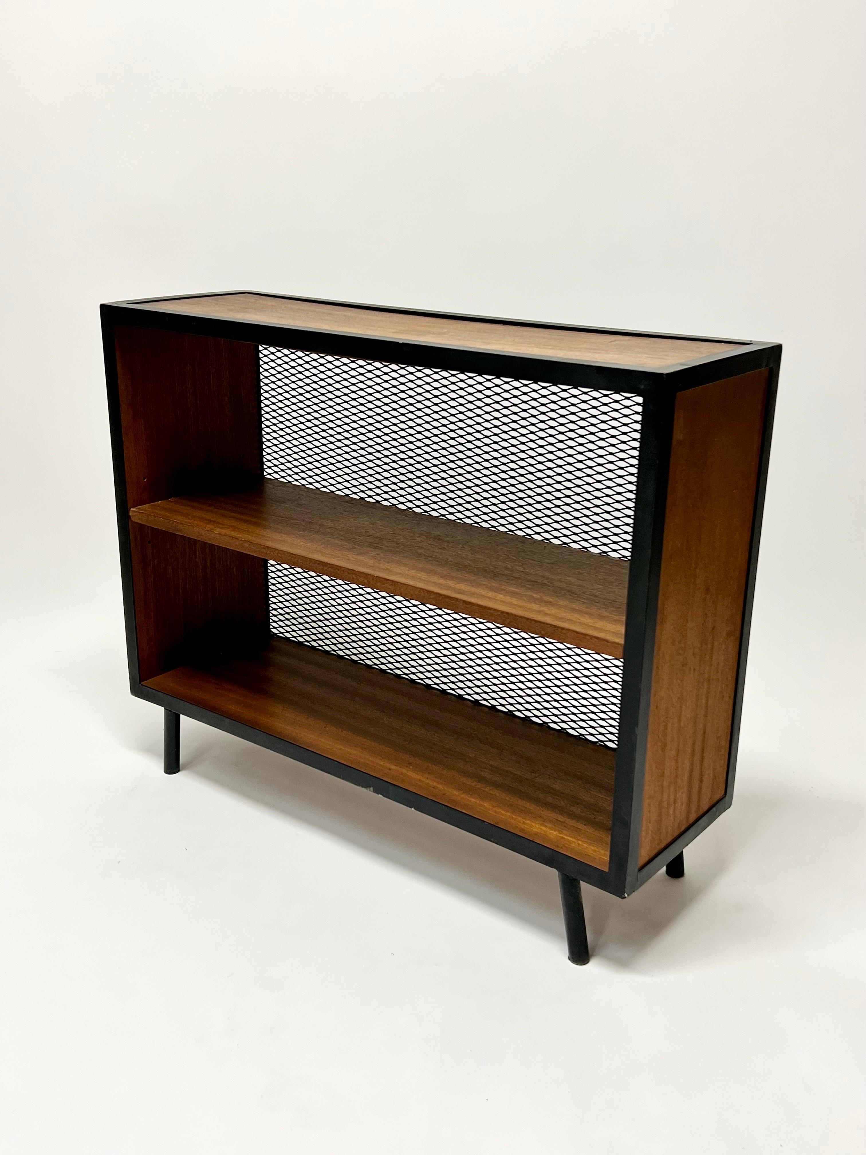 Rare small shelving unit designed by Donald Knorr for Vista of California circa 1950s. Expanded metal backing a heavy gauge iron frame with beautiful mahogany wood. Excellent California modern design.