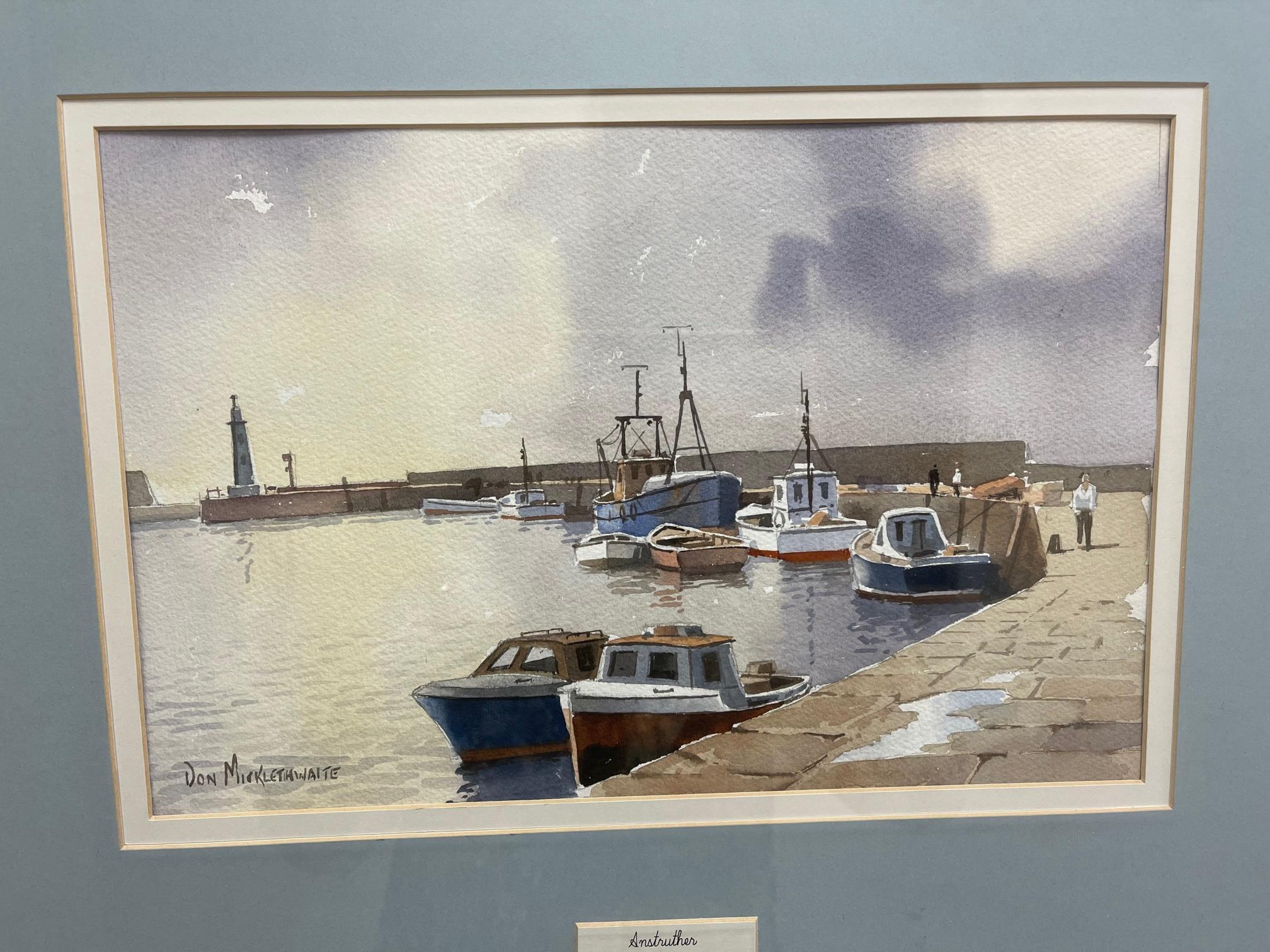 Watercolor on paper, signed Don Micklethwaite on recto (bottom left), framed size 26”l x 22”w x 1”d; unframed size 14” x 9”. Boats in a Harbour at Low Tide. British Artist Don Micklethwaite born in Scarborough and received a short formal training at