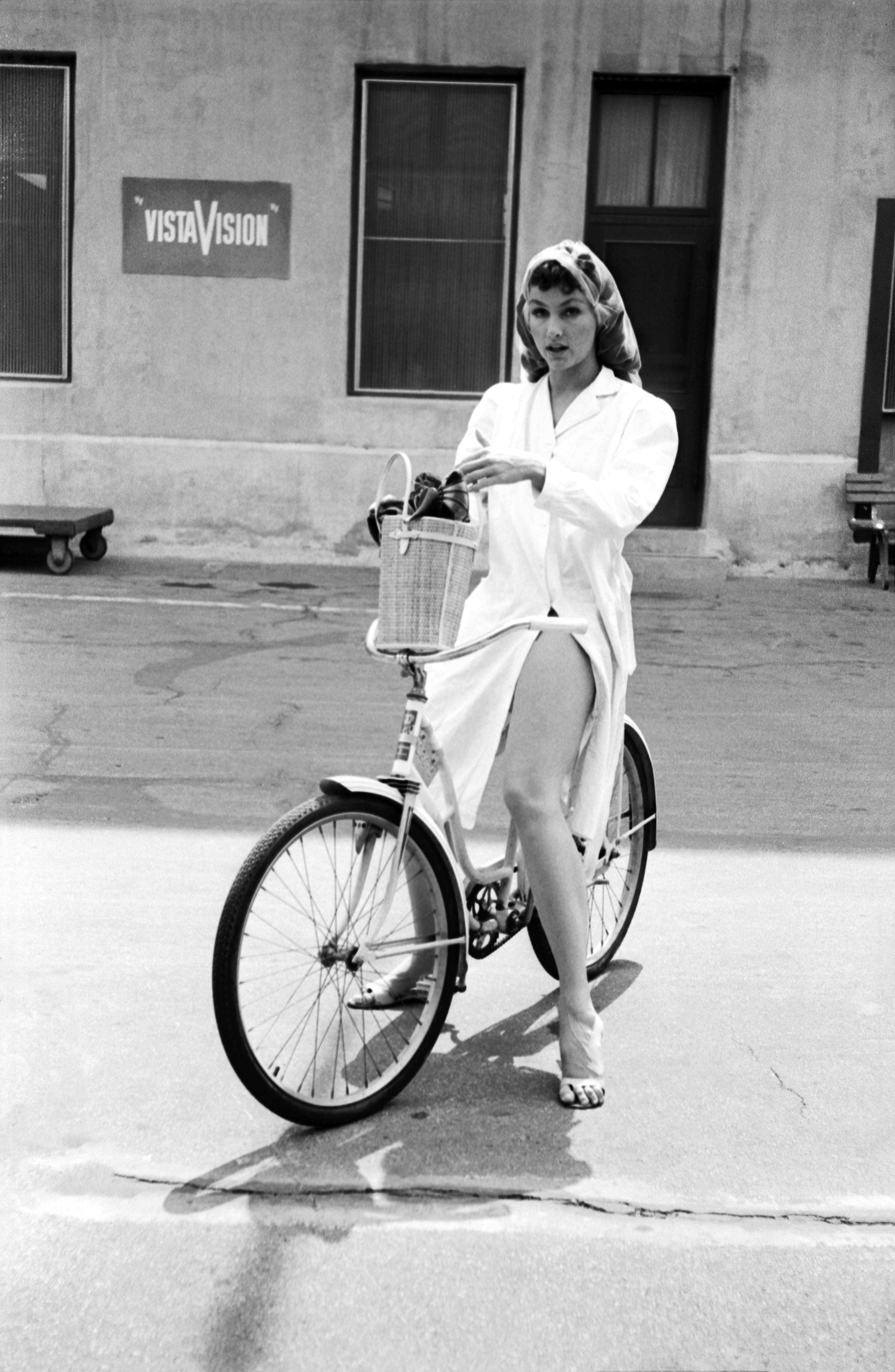 Don Ornitz Black and White Photograph - Julie Newmar on Bicycle Fine Art Print