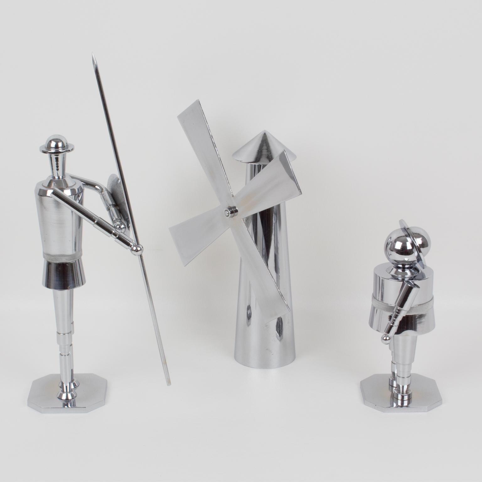 A stunning trio of Machine Age chromed metal sculptures, featuring Don Quixote, Sancho Panza, and a windmill. Incredible precise metal sculpture works with Machine Age stylized robot look in heavy chromed brass.
Don Quixote, a Spanish novel by
