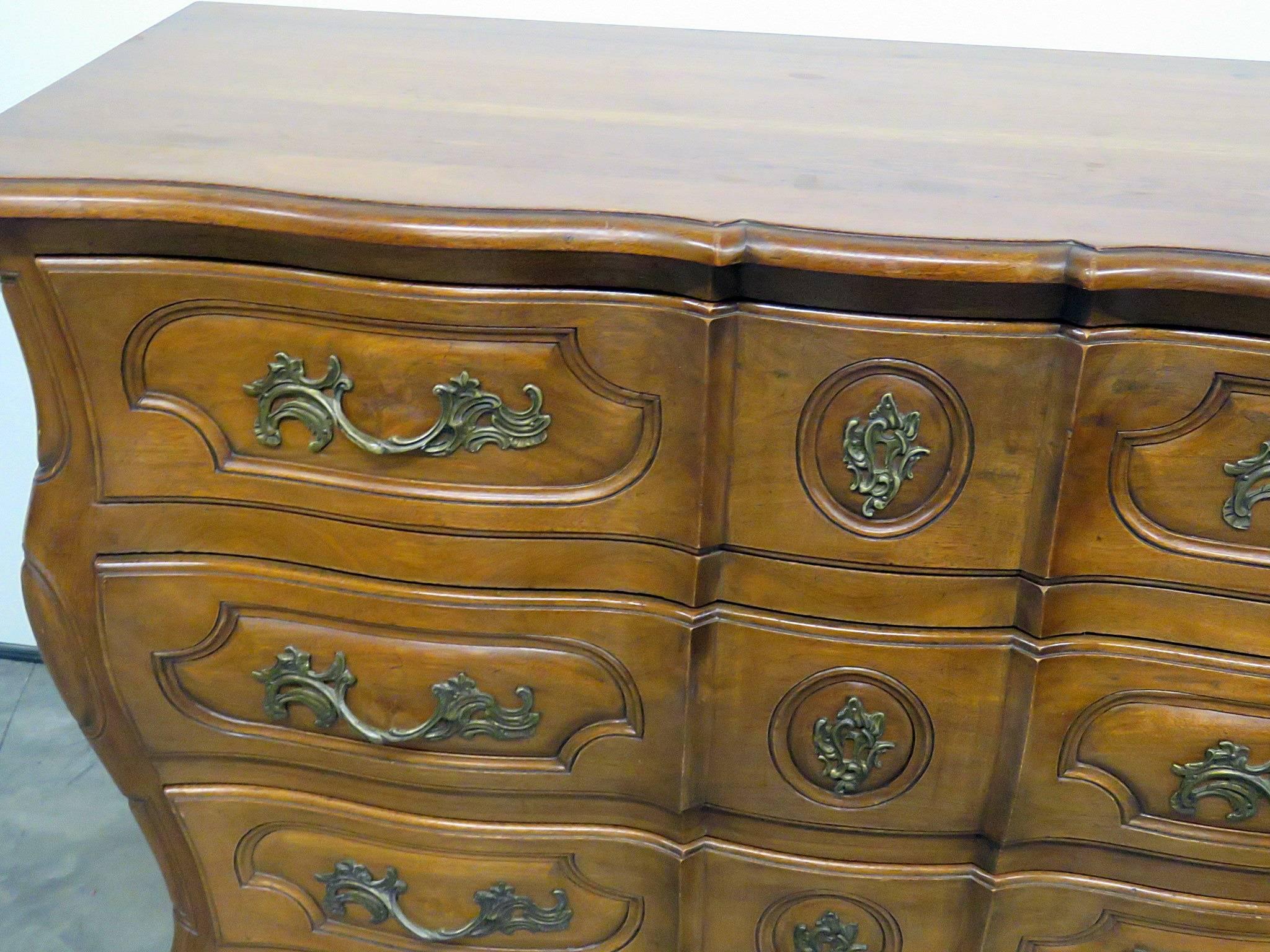 Don Rousseau Provincial style three-drawer Bombay commode.