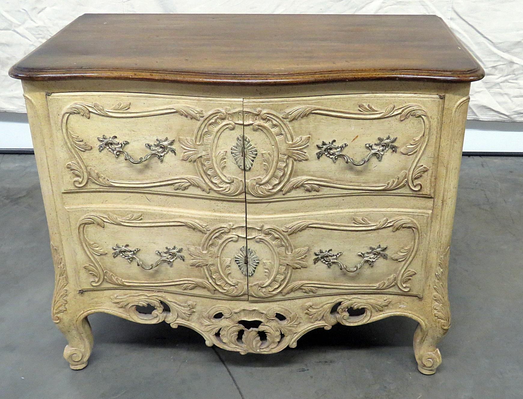 Don Rousseau style distressed painted commode with 2 doors containing 2 shelves.