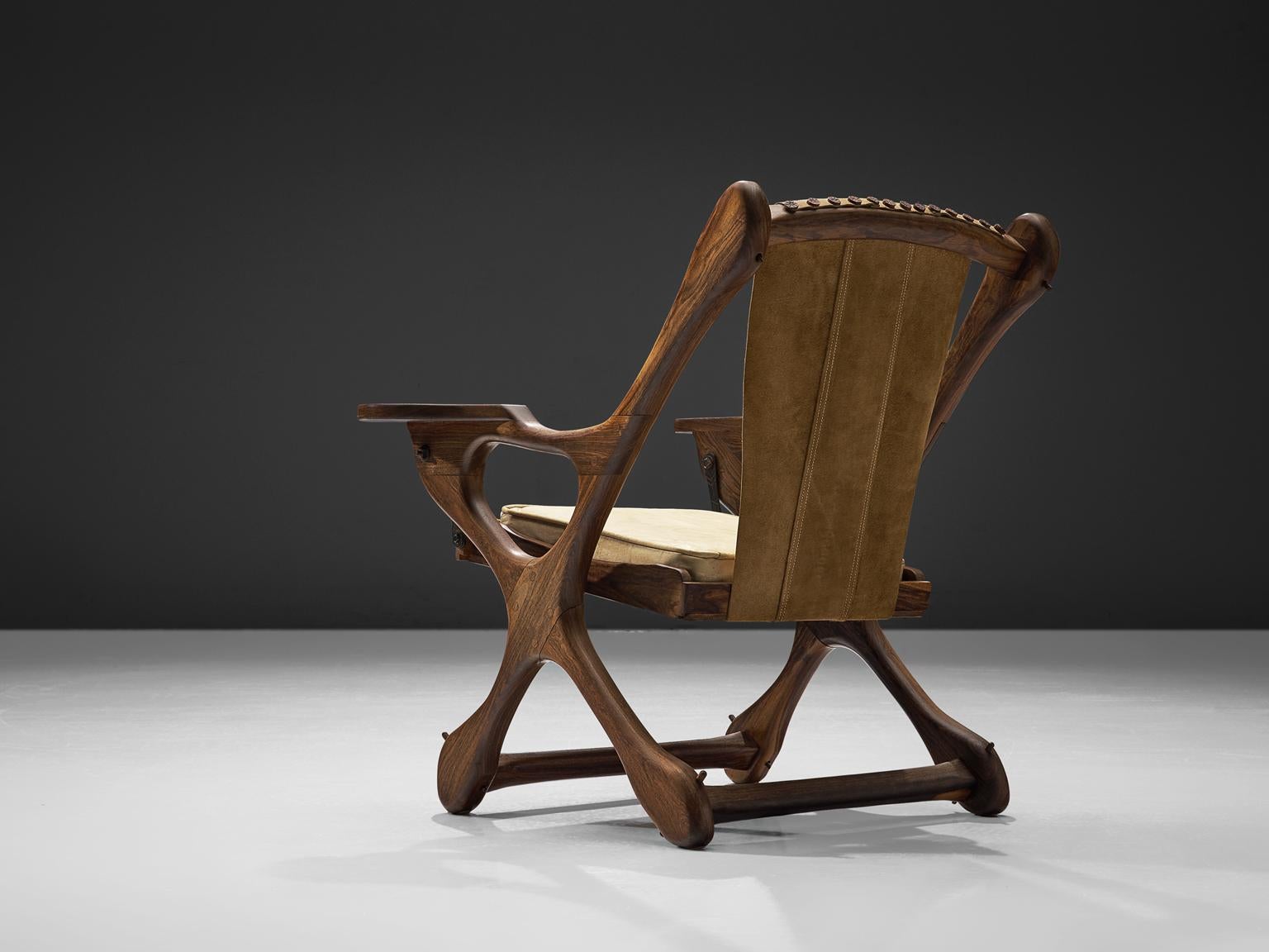 Don S. Shoemaker for Señal Furniture, lounge chair, cocobolo and beige leather, Mexico, 1960s. 

This iconic swinger lounge chair is executed in Cocobolo rosewood and leather. This sling chair has a characteristic organic shaped bone frame.