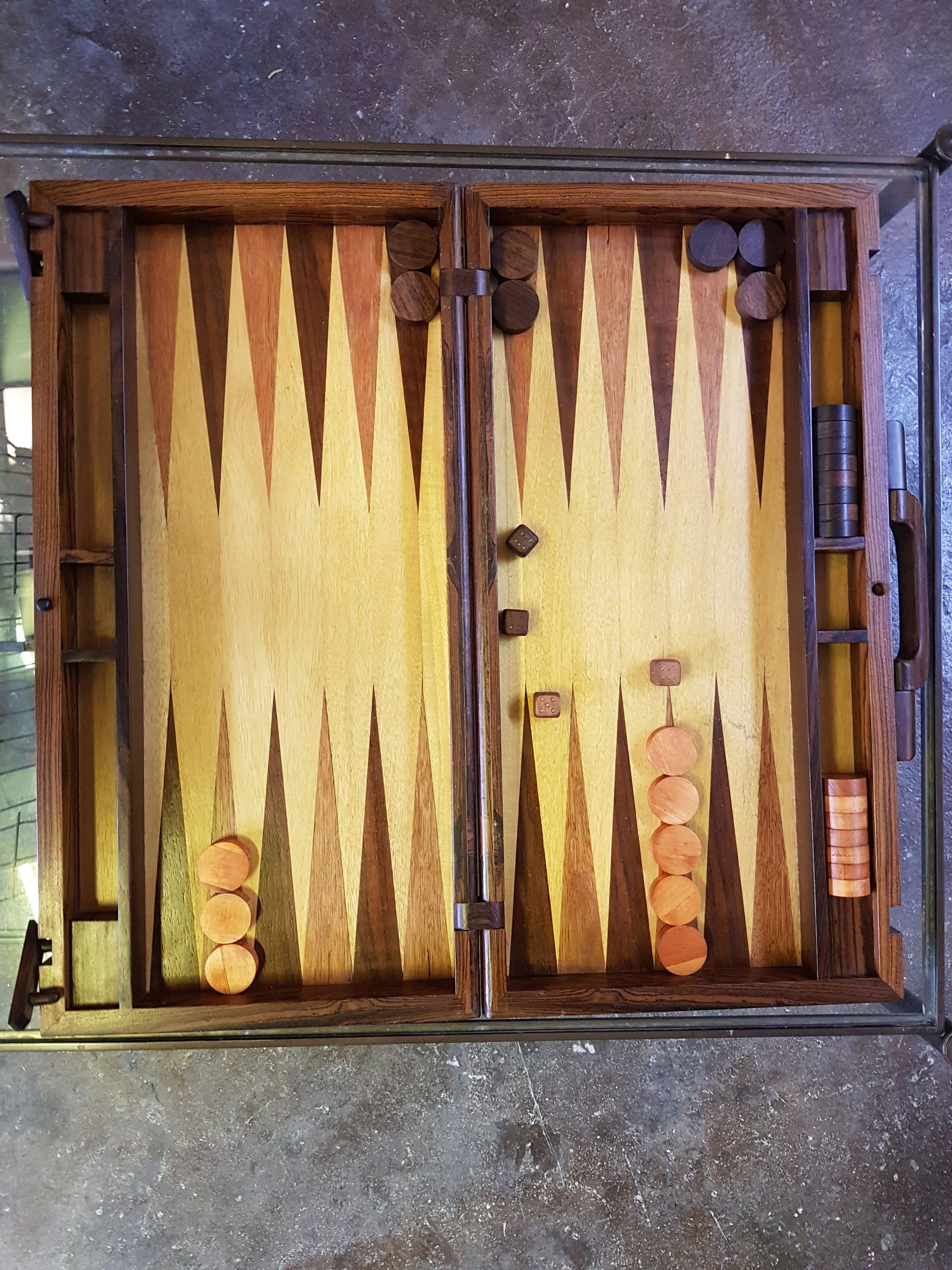 Beautiful Mexican Mid-Century Modern tropical wood backgammon set with marquetry by Don S. Shoemaker. Designed as a suitcase. The exterior marquetry shows geometric inlays of cuéramo, granadillo and rosewood. The board also shows marquetry over a