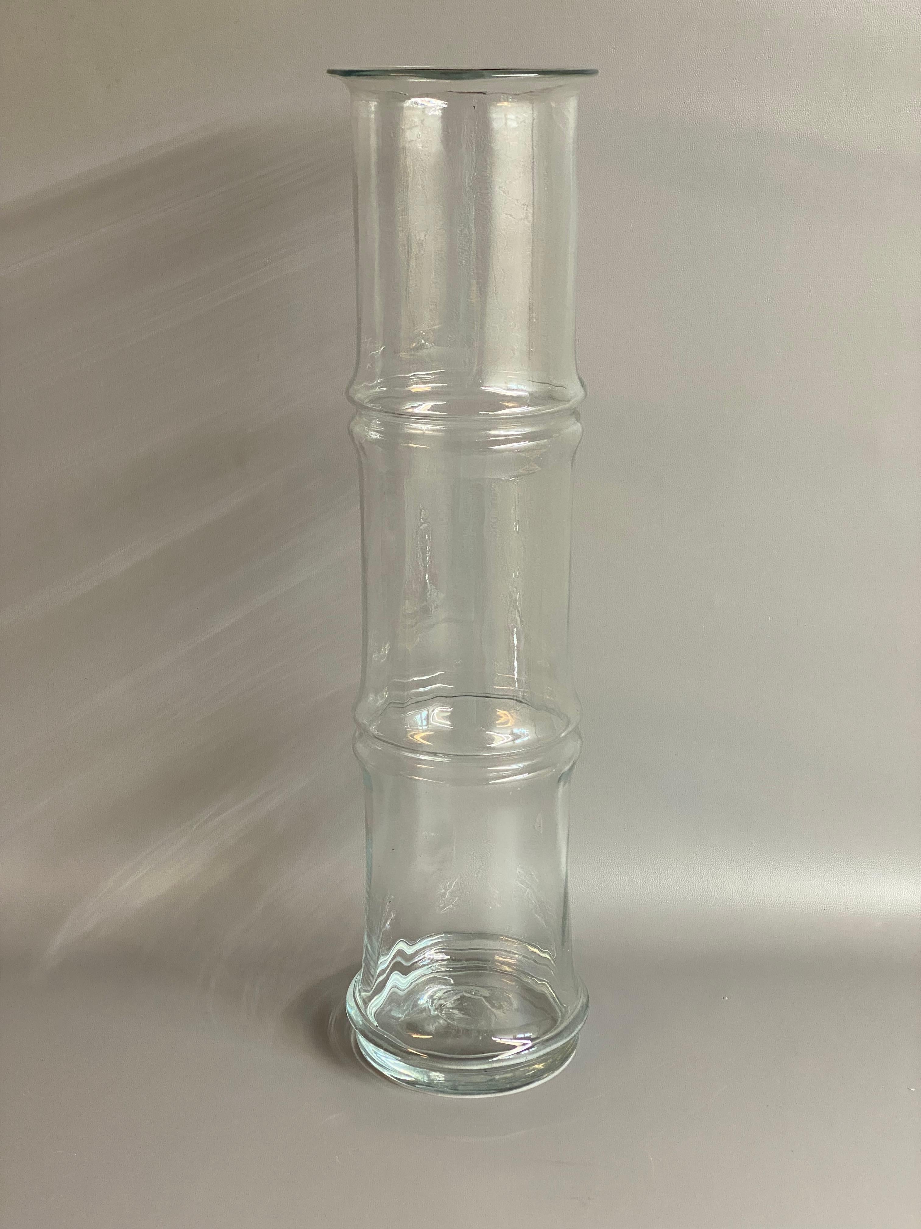 Very large and impressive clear glass Bamboo vase designed by Don Shepherd for Blenko Glass, #7820. Due to its large size it's a versatile piece that can feature on a case piece or table or as a floor vase. This piece dates circa 1970-1980. Hand