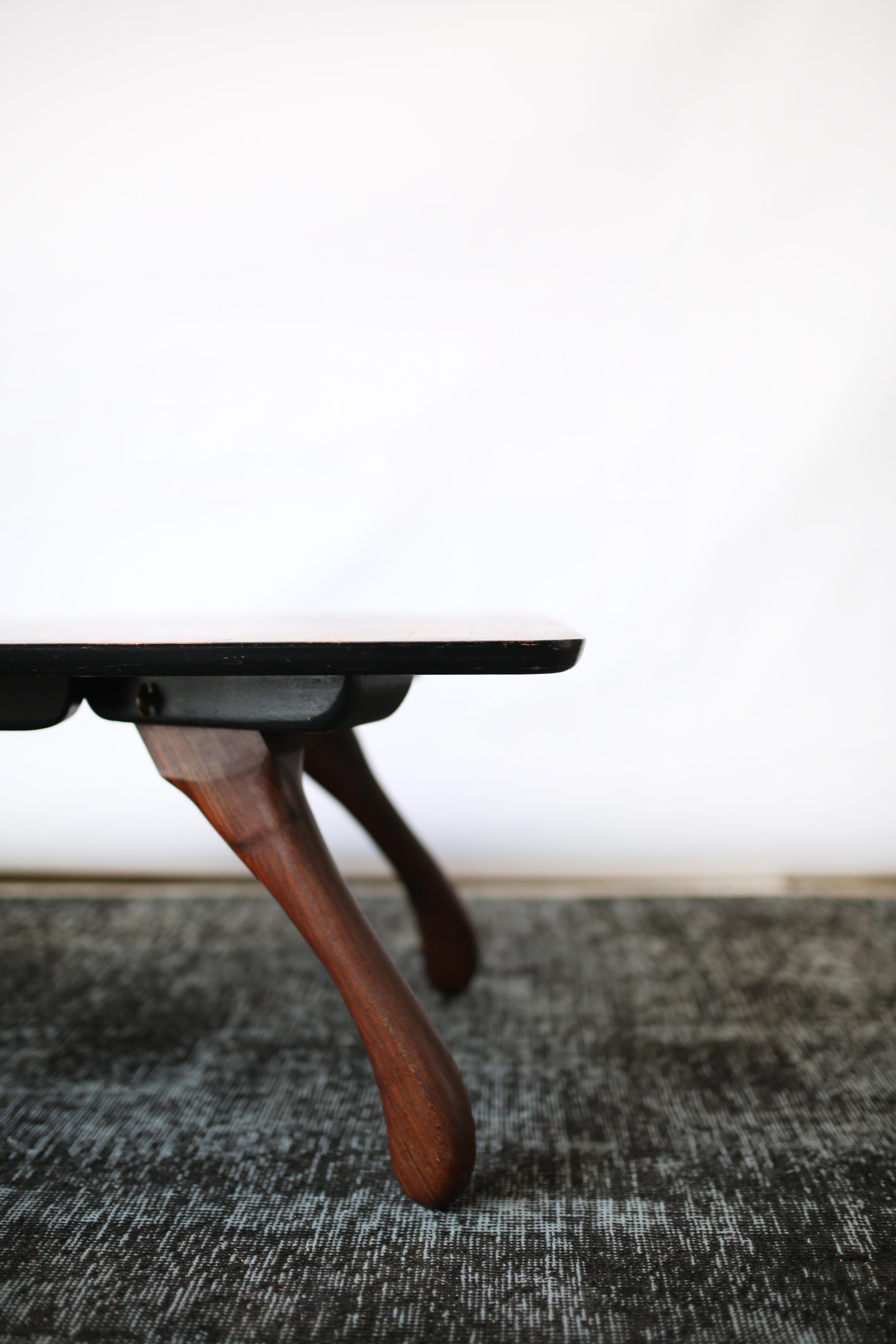 The 'Cuerno' coffee table is one of the few pieces crafted from Cocobolo, the tropical hardwood, by Don Shoemaker,
circa1970s
In good condition, with minor wear to tabletop and legs.
Dimensions: D 24