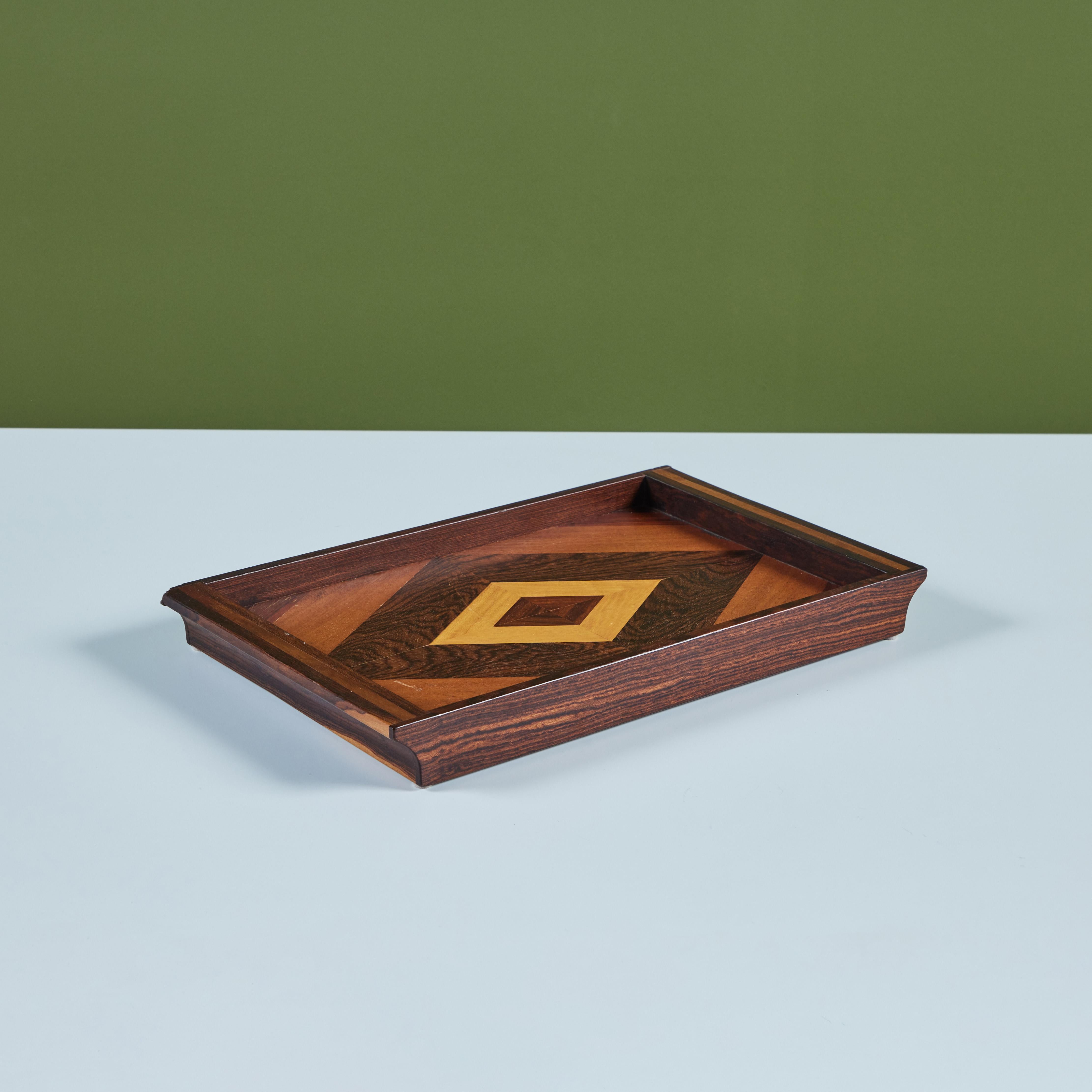 Serving tray by Don Shoemaker for Senal of Mexico. The tray has a dark rosewood frame with integrated handles at either end, and the tray surface is inlaid with precious wood veneer in a diamond pattern.

CITES Notice: Due to stringent regulations