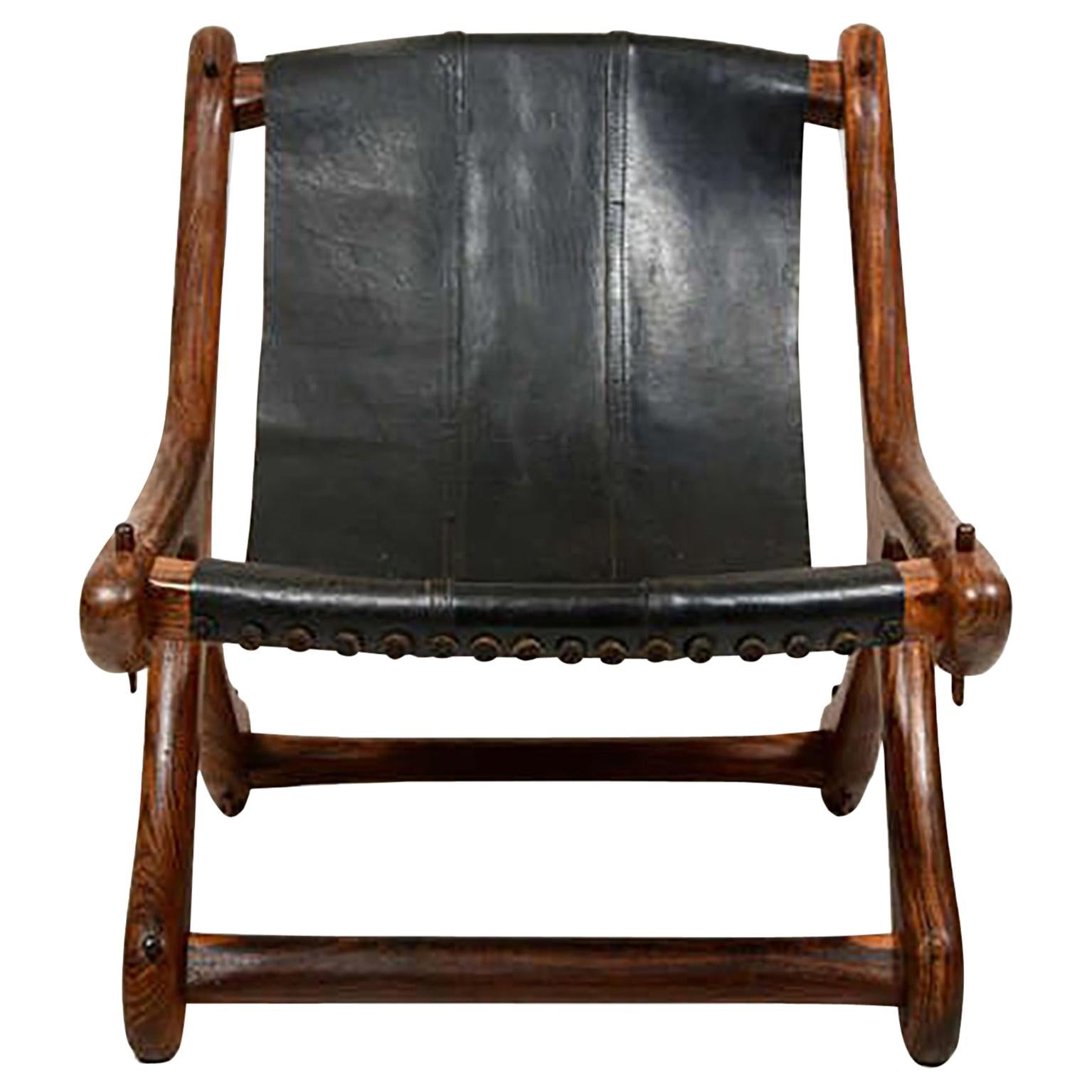 AMBIANIC presents
Modern SLOUCHER Leather SLING Chair in Exotic Wood designed and produced by famed modernist, Don S Shoemaker. Mexico, 1960s
Rare Solid Cocobolo Wood frame with Black leather Sling Seat.
Ghost shadow is present where the original