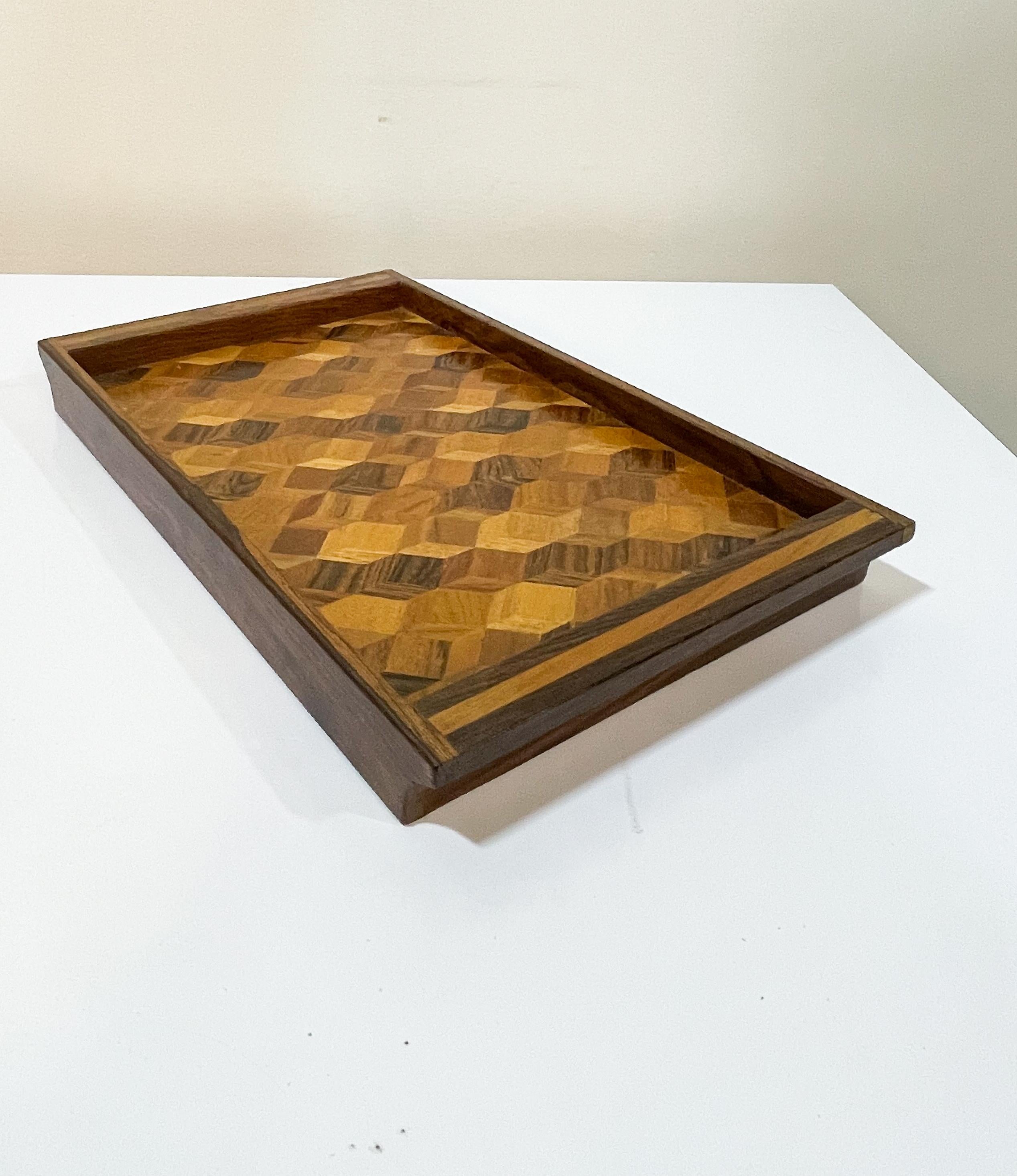 Eye-catching 1960s geometric design of tropical hardwoods designed by Don S. Shoemaker and made in Mexico by his company Senal, S.A. Practical and beautiful, this mid-century modern tray can be used as-is for keys, coins, jewelry, drinks, and more.