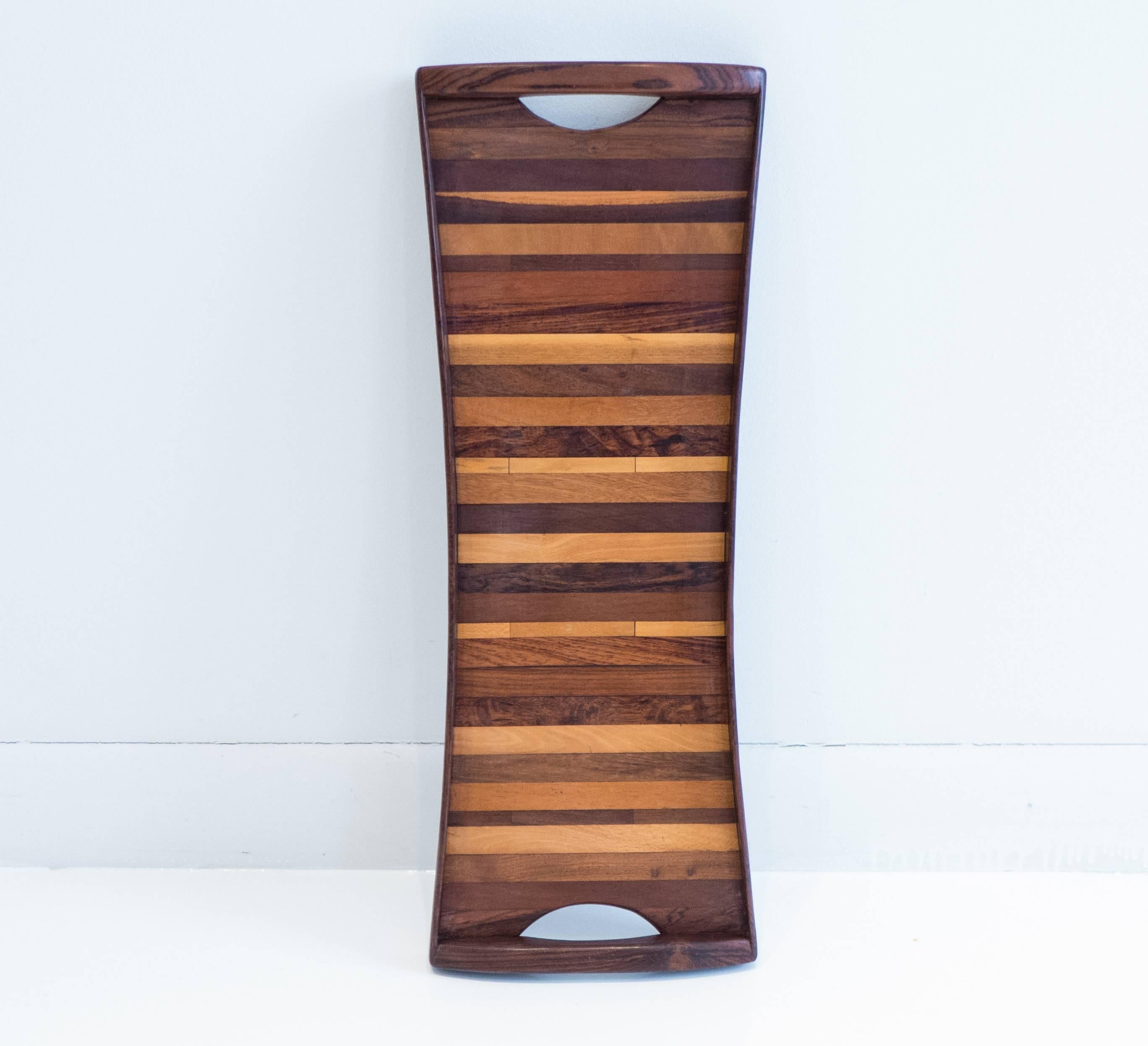 Nicely proportioned, butterfly-shaped tray with cocobolo sides and an interior pattern created out of strips of exotic woods. By expat designer Don Shoemaker, produced at his Senal, S.A. studio, Morelia, Mexico, circa 1960s. Retains original Senal