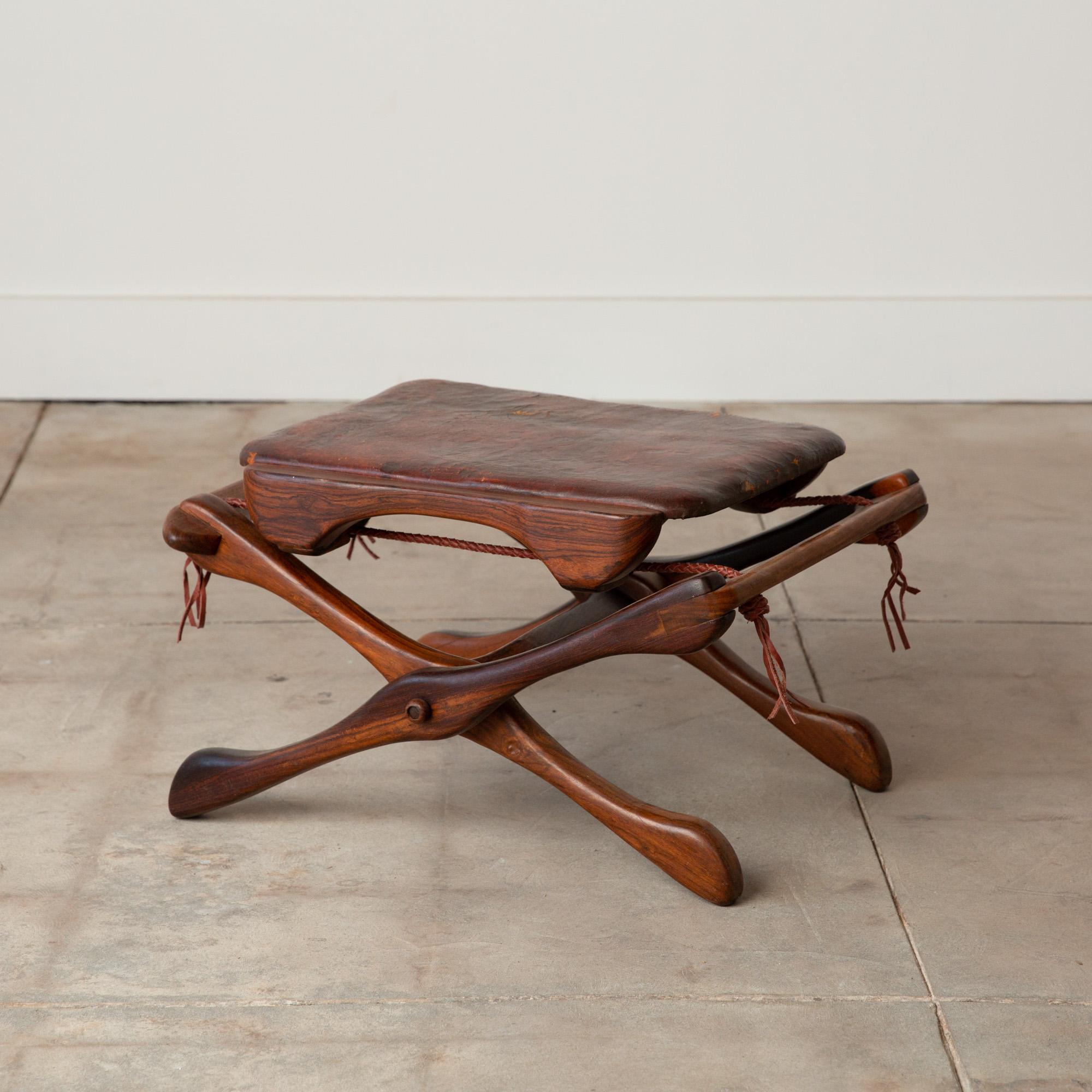 Leather folding stool by Don Shoemaker for Señal, Mexico, c.1960s. The stool features a folding rosewood frame and a removable seat with the original patinated leather upholstery and new leather support braiding.

Dimensions: 22