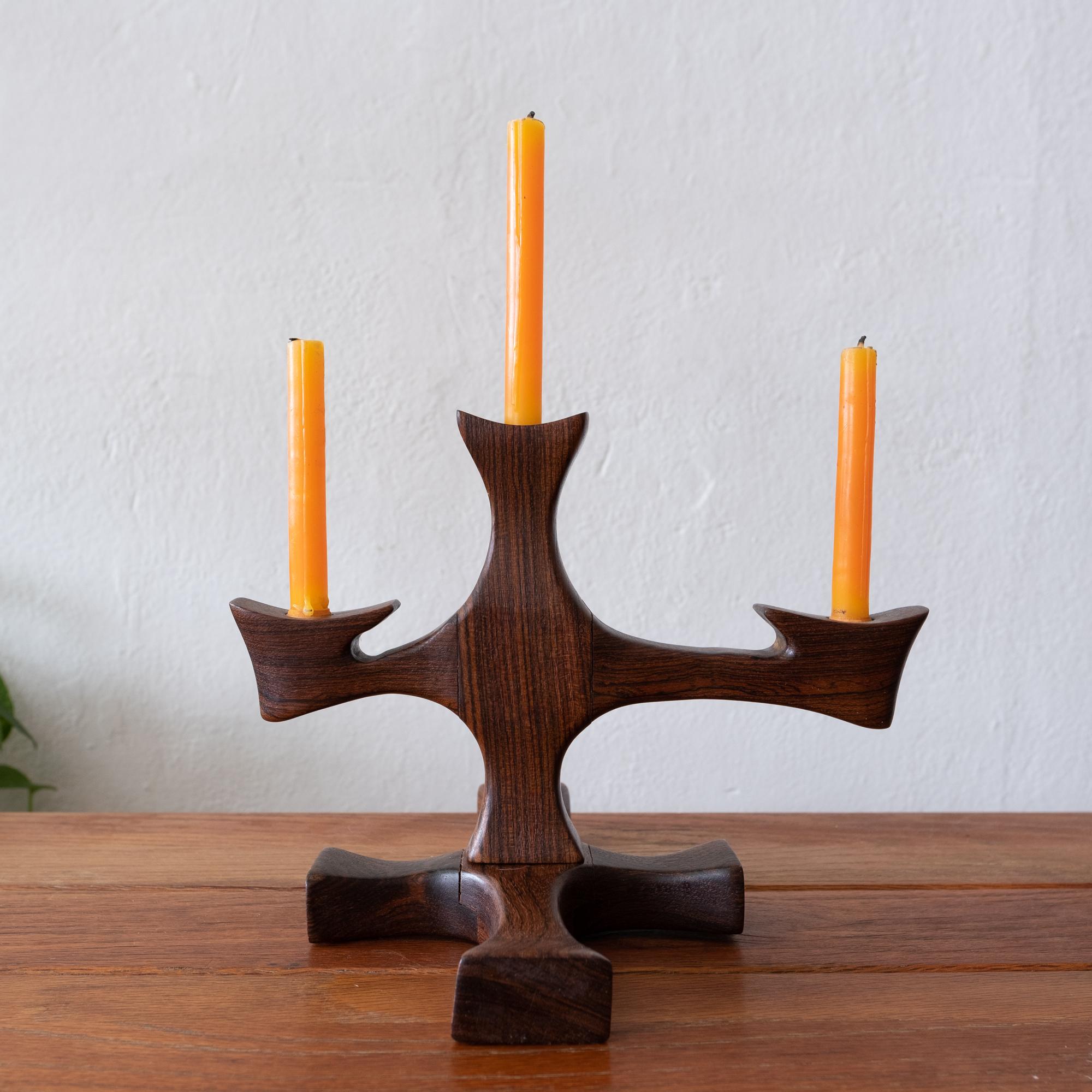 Hand carved candleholder in Cocobolo by Mexican Modernist Don Shoemaker. Retains original candles and labels from his workshop in Señal Mexico. This design was included in the 2017 Don S. Shoemaker exhibition at the Museo de Arte Moderno in Mexico