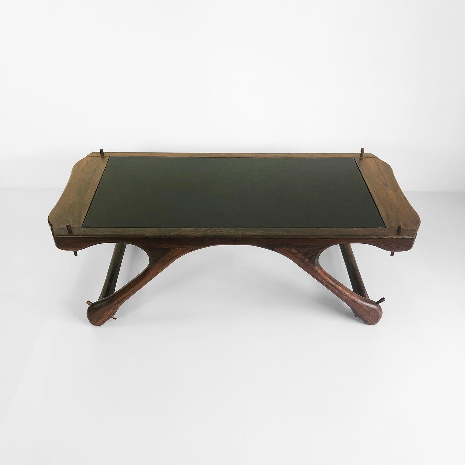 We offer this fantastic coffee table made in pieces of solid cocobolo wood with leather top designed by Don Shoemaker for Señal S.A., circa 1960

About Don Shoemaker:

Coming from an affluent family, Don was originally from Nebraska. During the
