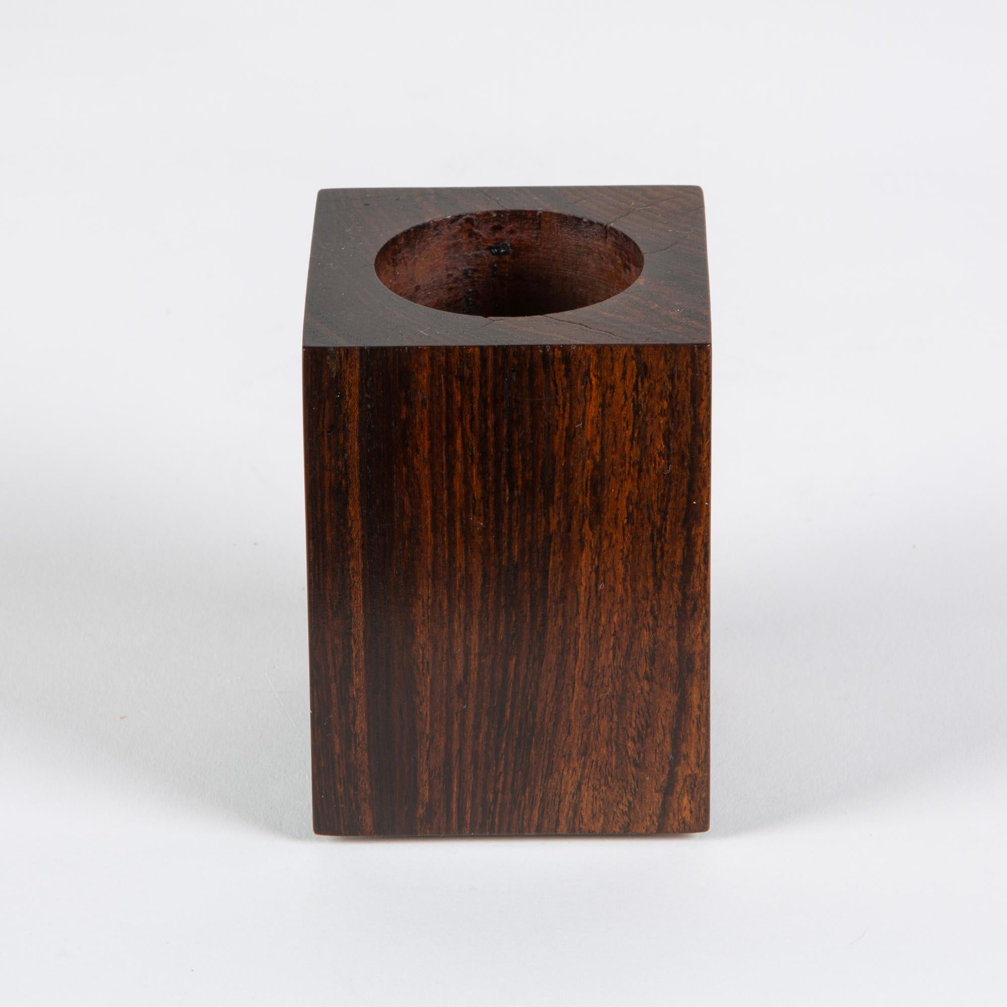 Don Shoemaker block vessel for Señal Rosewood vessel. The hand carved minimalist vessel features a geometric block design with circular carving in the center of the vessel.

Labeled - SENAL S.A. Hecho en Mexico

CITES Notice: Due to stringent
