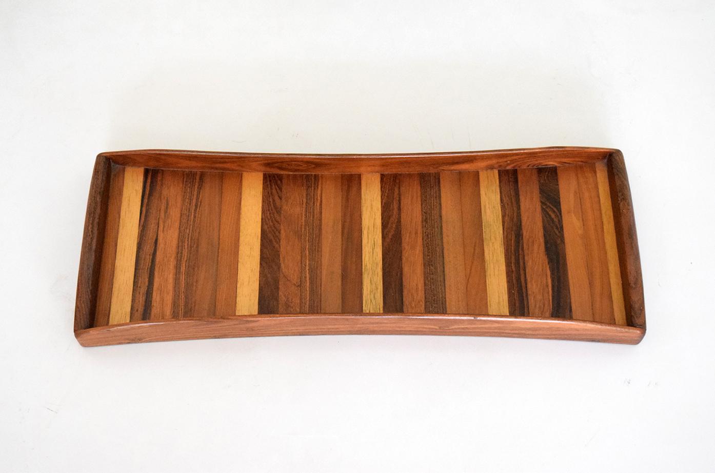 Amazing serving tray made in the 70 by iconic wood craftsman Don Shoemaker in Michoacan, Mexico.
Made out of different spieces of woods all of them endemic from Michoacan Mexico.

Very special piece of design.



 