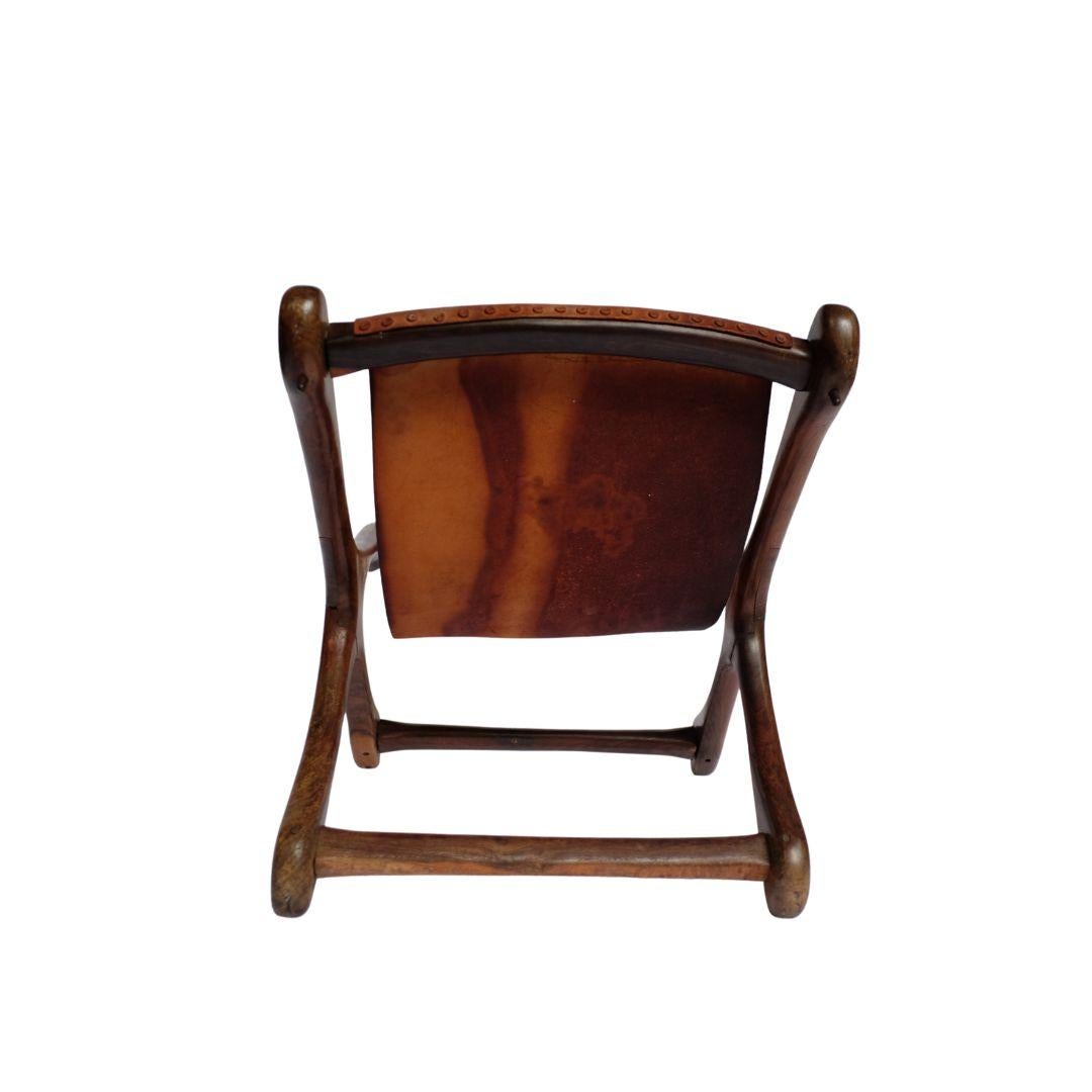 The iconic beautiful Don Shoemaker sling chair. Made for Señal S.A. Made from solid Cocobolo Wood with original brown leather. Made in the 1960s in Mexico in Santa Maria de Guido, overseeing the City of Morelia A classic midcentury modern original