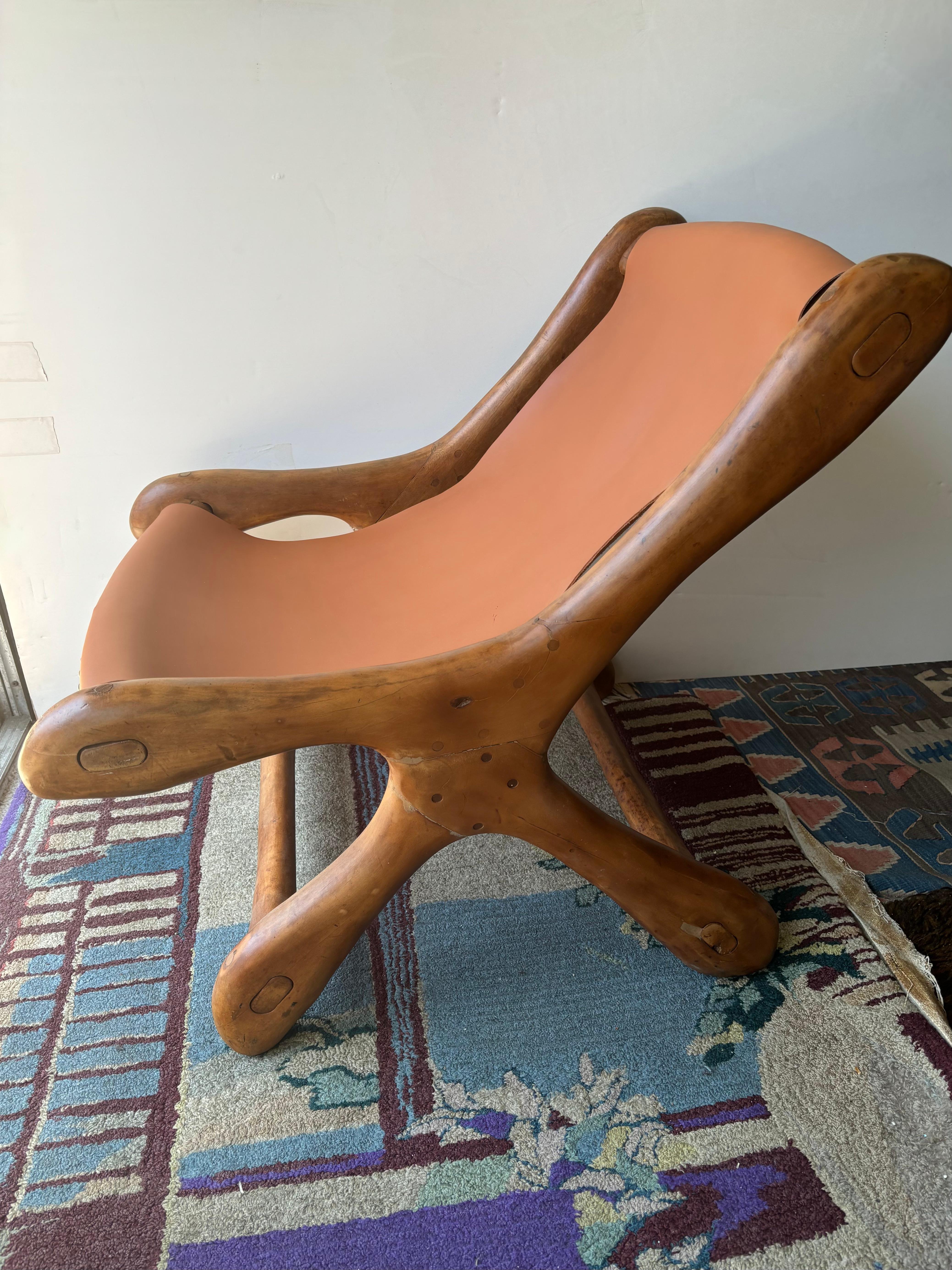 Great sling lounge chair in a fancy wood by Don Shoemaker .