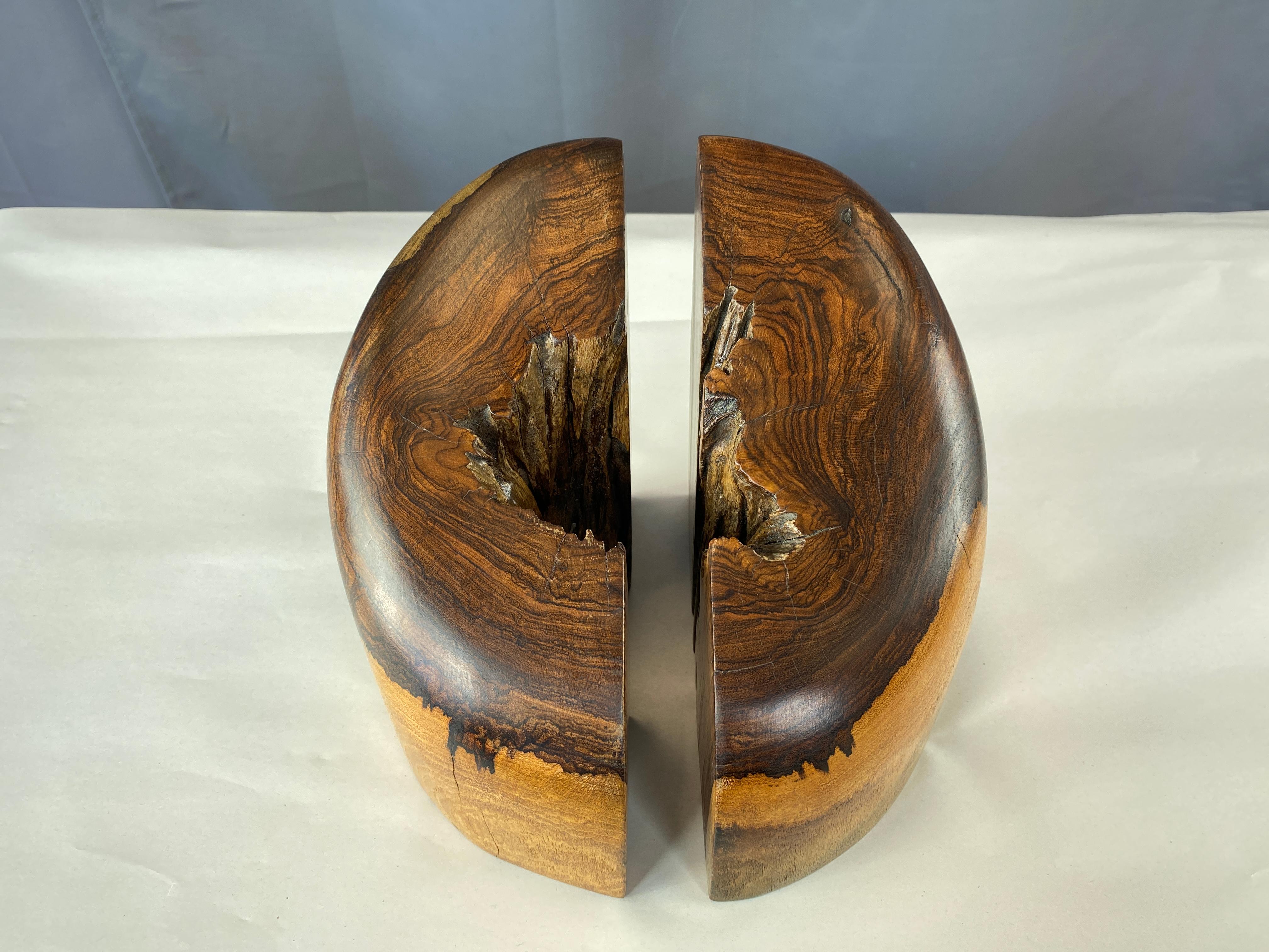 Offered here is a pair of solid Cocobolo wood bookends, designed by Don Shoemaker for Señal.
Cocobolo is a tropical hardwood from Central America, similar to Rosewood.

Left is 4 x 7.50 x 7.25 H Right is 3.75 x 7.50 x 7.25 H
Together below.