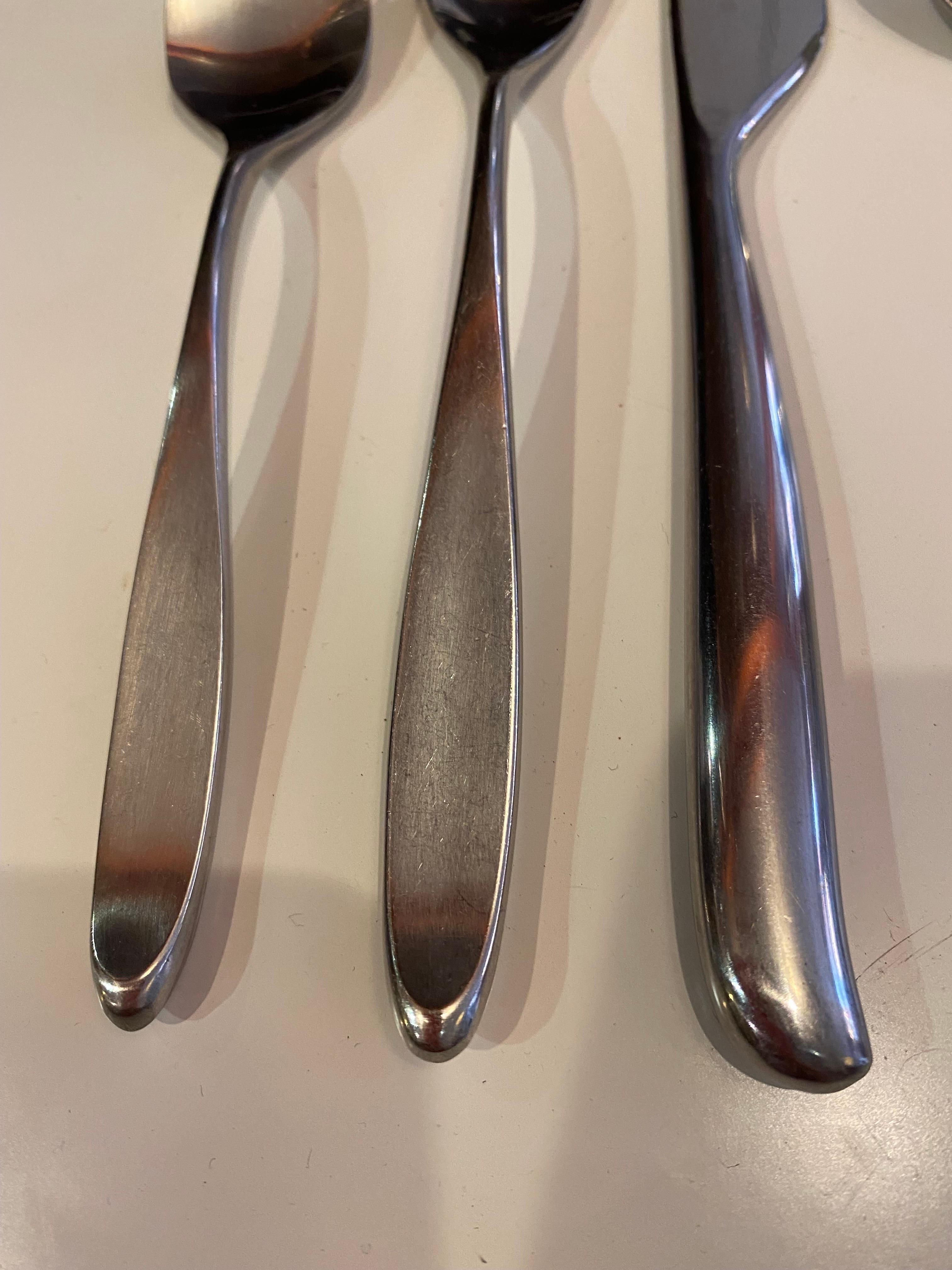 Don Wallance for Lauffer Design 2 Stainless Steel Flatware Set.  Service for 12 Set includes, dinner fork, salad fork, Dinner Knives, Soup Spoon and Teaspoon.  Set also includes to serving forks, sugar spoon and Ladle.  Beautiful Design and weight! 