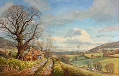 Magnifique grande peinture à l'huile représentant un paysage de campagne britannique avec une petite maison au toit de chaume