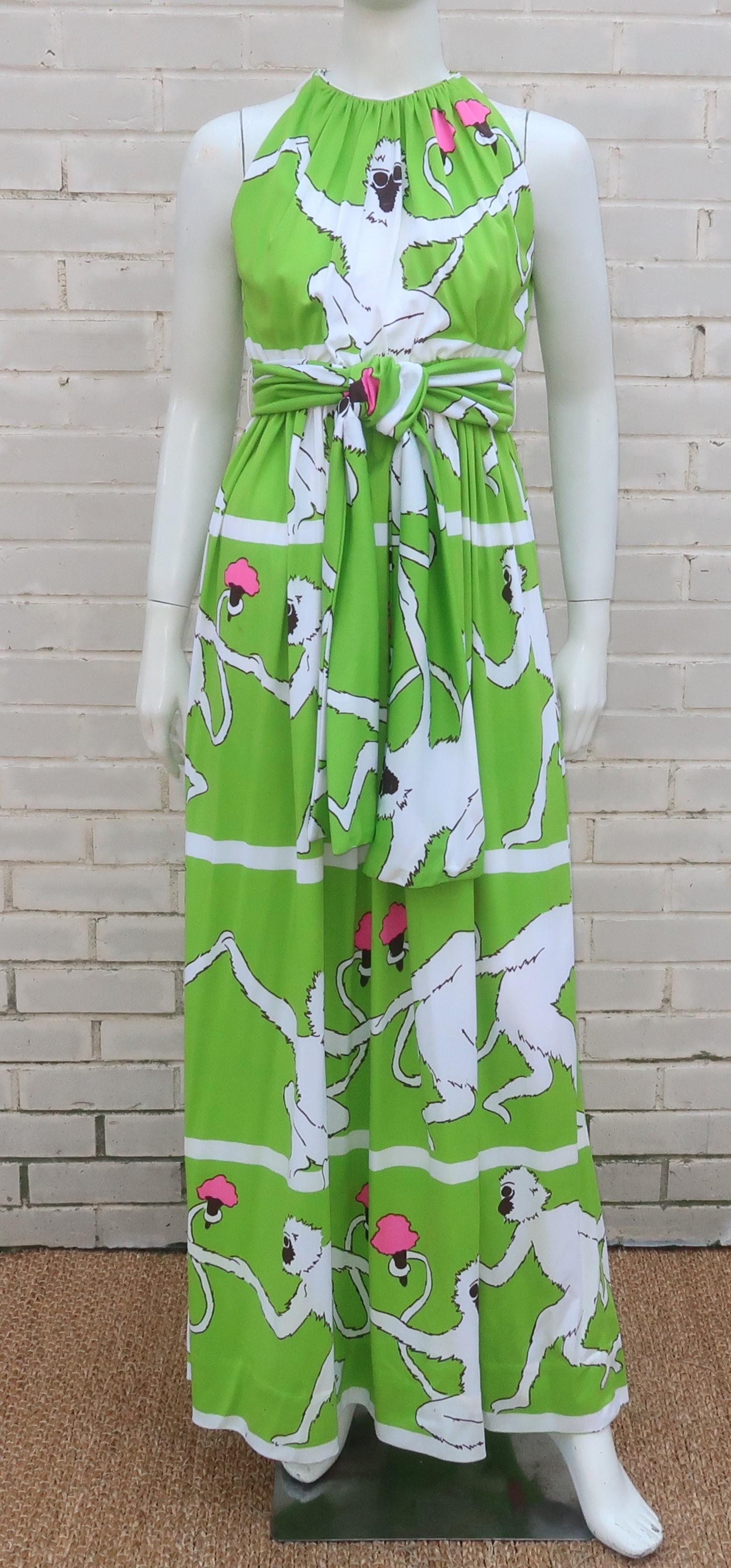 1970's jersey maxi dress with a racer back style neckline and a whimsical monkey print by Donald Brooks.  The dress zips up to the back waistline and ties at the top of the keyhole back.  The monkey print is in a striking white and almost black