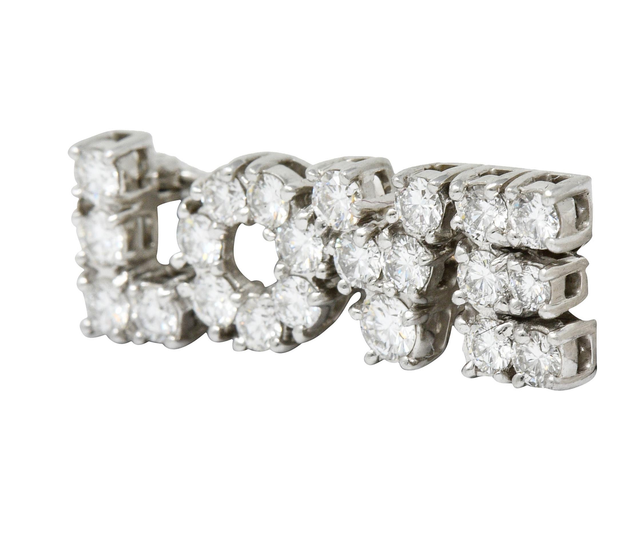 Brooch is comprised of prong set round brilliant cut diamonds spelling the word 'LOVE'

Weighing in total approximately 2.16 carats with F/G color and VS clarity

Completed by pin stem with locking closure

Stamped for platinum

Fully signed Tiffany