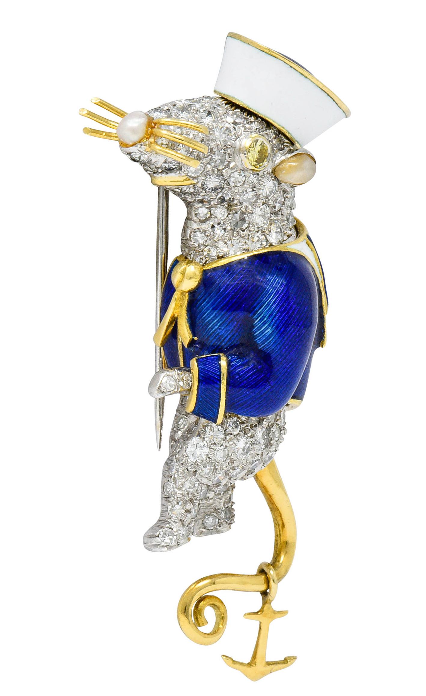 Whimsical brooch is a stylized depiction of Stuart Little, a mouse in a sailor's outfit from children's literature

The outfit is brightly glossed with white and blue enamel; exhibiting no loss

His eye is a bezel set fancy yellow diamond weighing