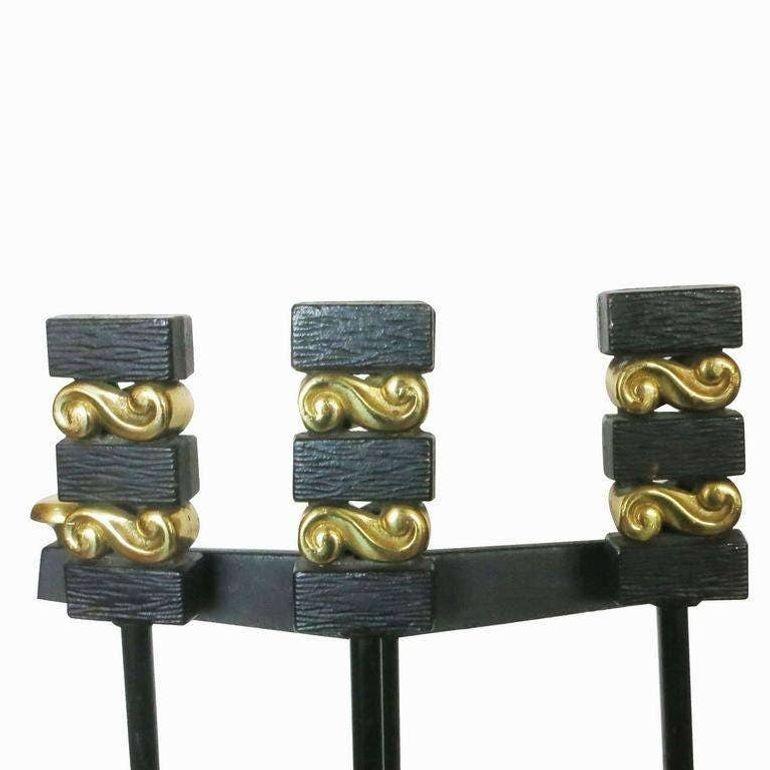 A set of modernist iron and brass Donald Deskey andirons and fireplace tools by the Bennett Co.
This set includes stand, shovel, brush, pocker and set of two andirons.
Fireplace tools on stand
32