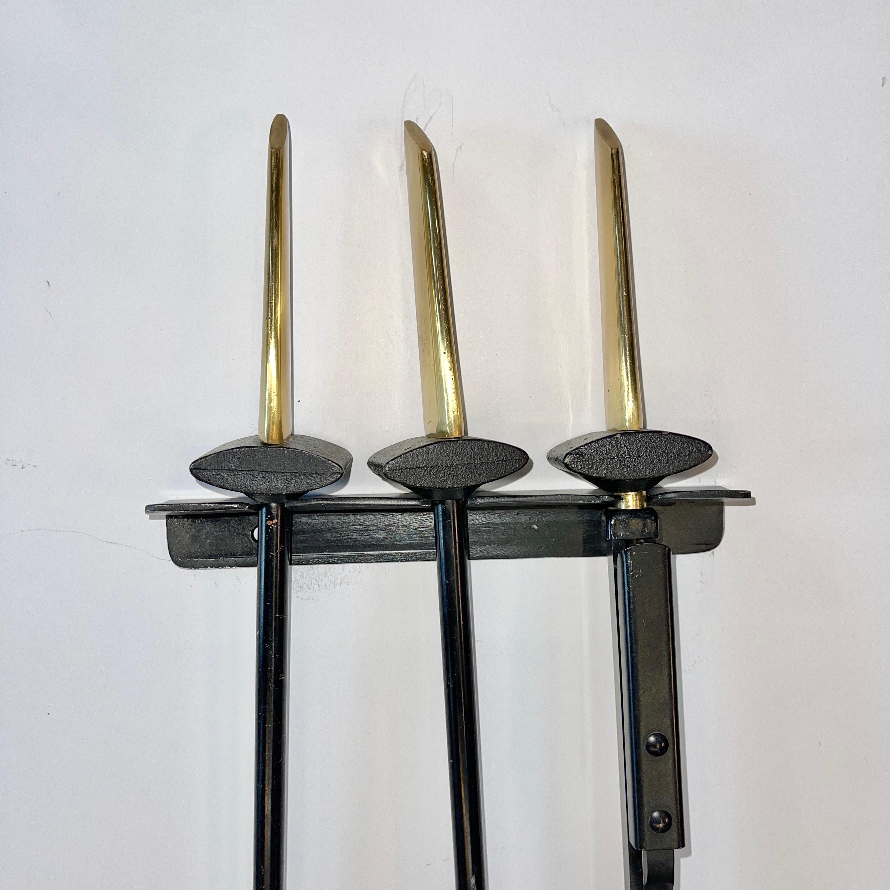 Brass Donald Deskey Andirons and Wall Mounted Fireplace Tools by Bennett For Sale