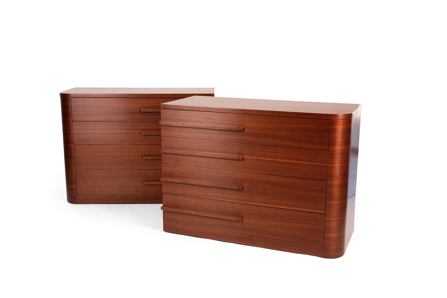 This chest of drawers pair was created in the 1930s by Art Deco master and designer of Radio City Music Hall, Donald Deskey. The pair reflect one of Deskey's sleek signatures by showing a combination of both right angles and curves. The matching