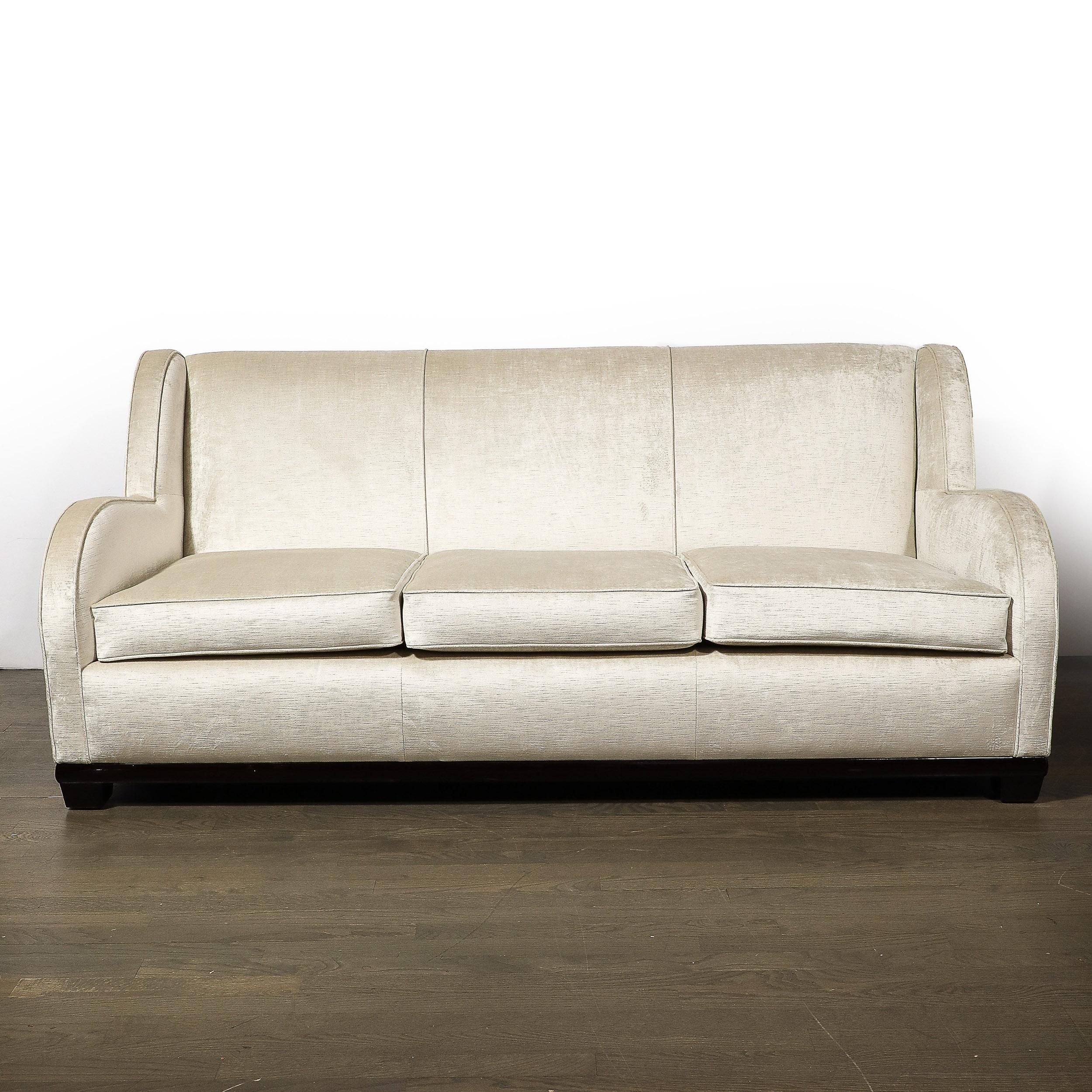 This elegant and historically important sofa was designed by the legendary Donald Deskey- the man responsible for the design of Radio City Music Hall where this sofa was originally housed- in 1932. This iconic piece offers a cloud form motif