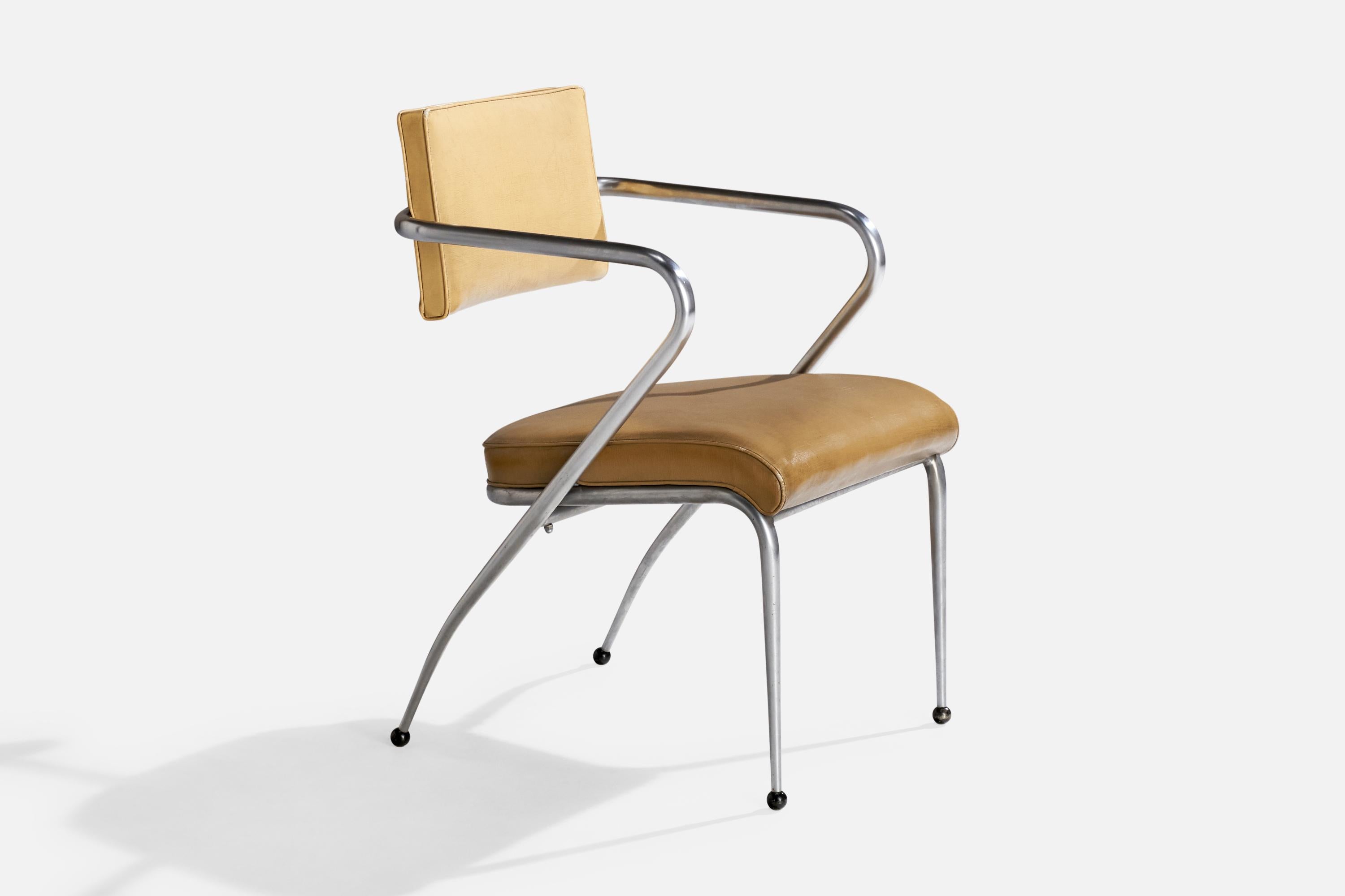 A matte-chrome plated steel and beige oil cloth armchair attributed to Donald Deskey, USA, c. 1939.

Seat height: 17.25”

All upholstered furniture can be reupholstered upon request for an additional fee. Lead times will be an additional 1-3 weeks