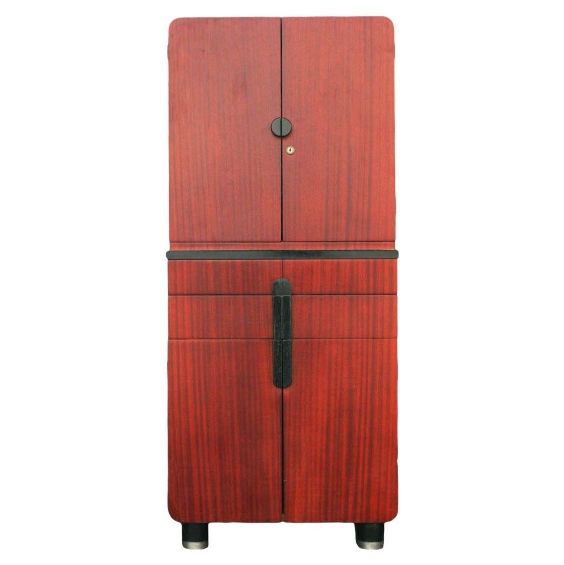 Streamline Art Deco medical cabinet doubles as a dry bar by the Hamilton company of Milwaukee designed by Donald Deskey. Cabinet features two doors on top and bottom with two pull-out drawers in the center,

circa 1930.