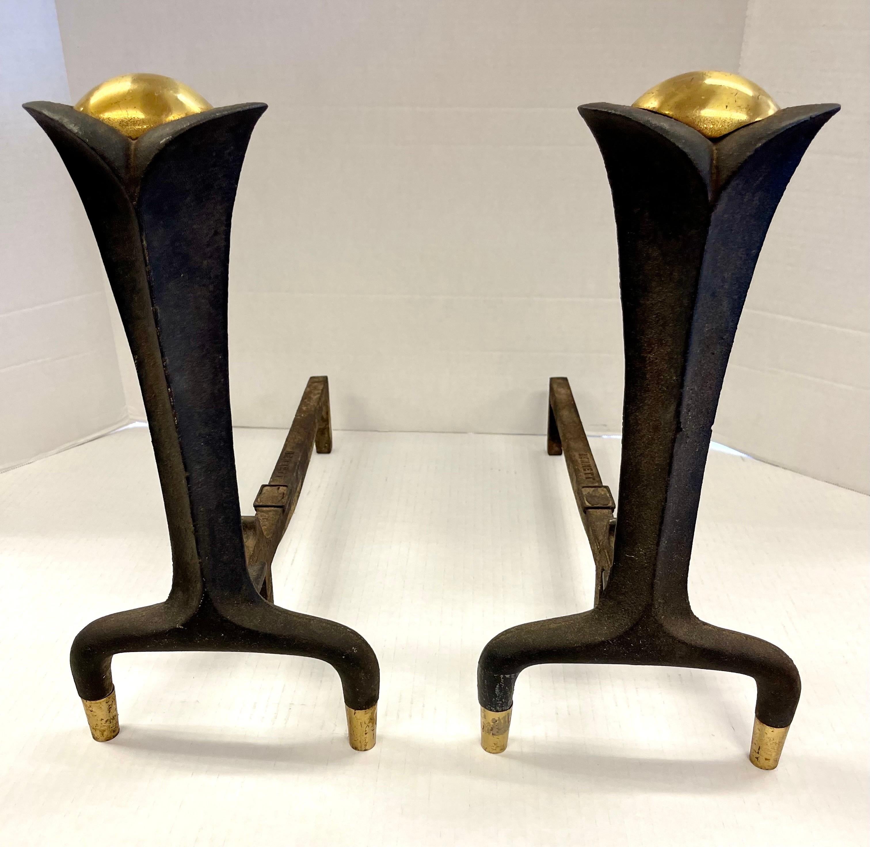 Elegant and rare signed Donald Deskey Bennett cast iron and brass andirons.
Age appropriate wear and gorgeous patina. Brass at top and bottom. Why not own the best?.