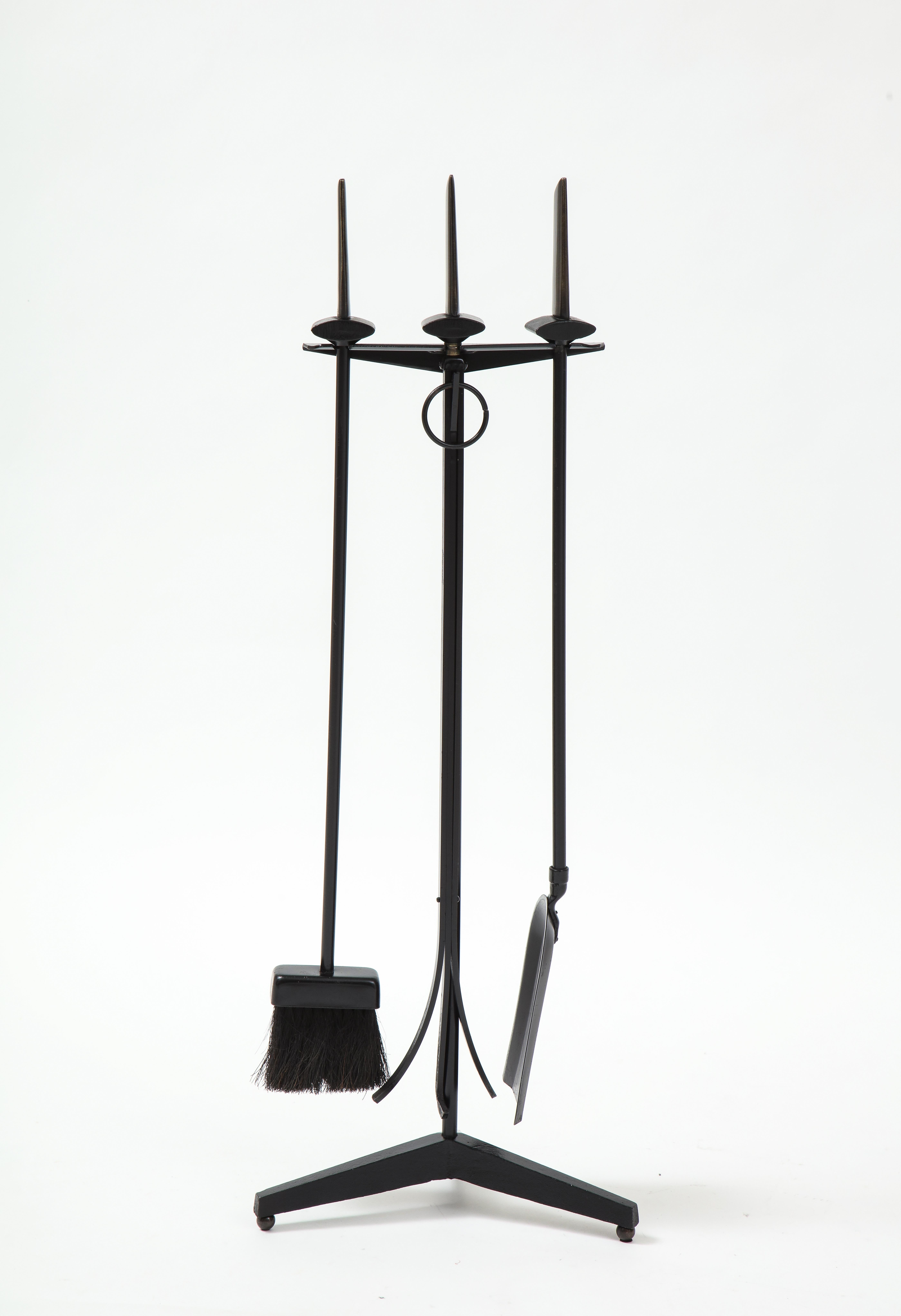 Set of Art Deco firetools in a black enamel finish with custom finshed bronze blade handles. Set includes poker, shovel, broom and stand.