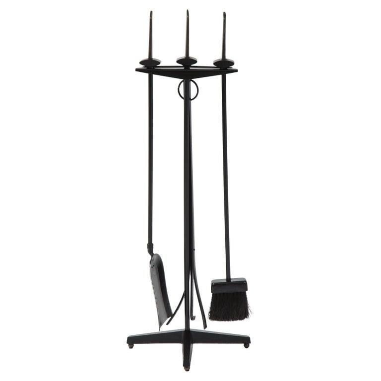 Set of Art Deco firetools in a black enamel finish with custom finshed bronze blade handles. Set includes poker, shovel, broom and stand.