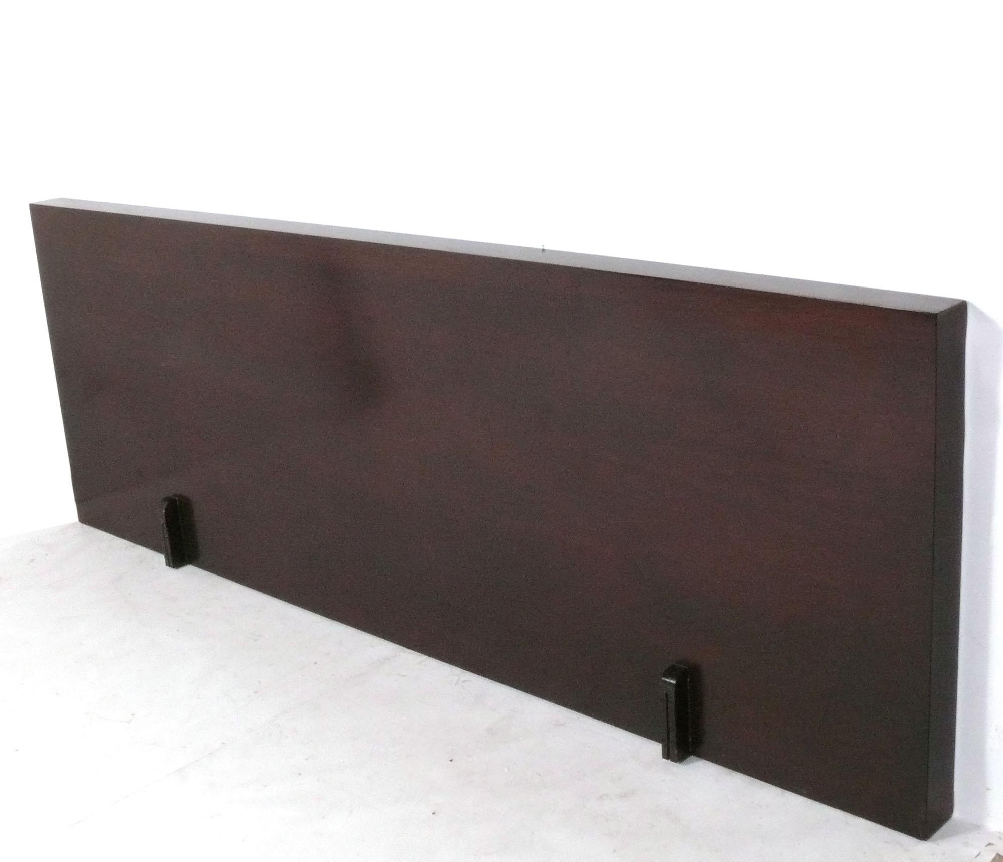 Clean Lined Art Deco Headboard, designed by Donald Deskey, American, circa 1930s. It retains its original espresso brown color finish in very good shape. If you prefer, we can refinish it in your choice of color for an additional charge. Please