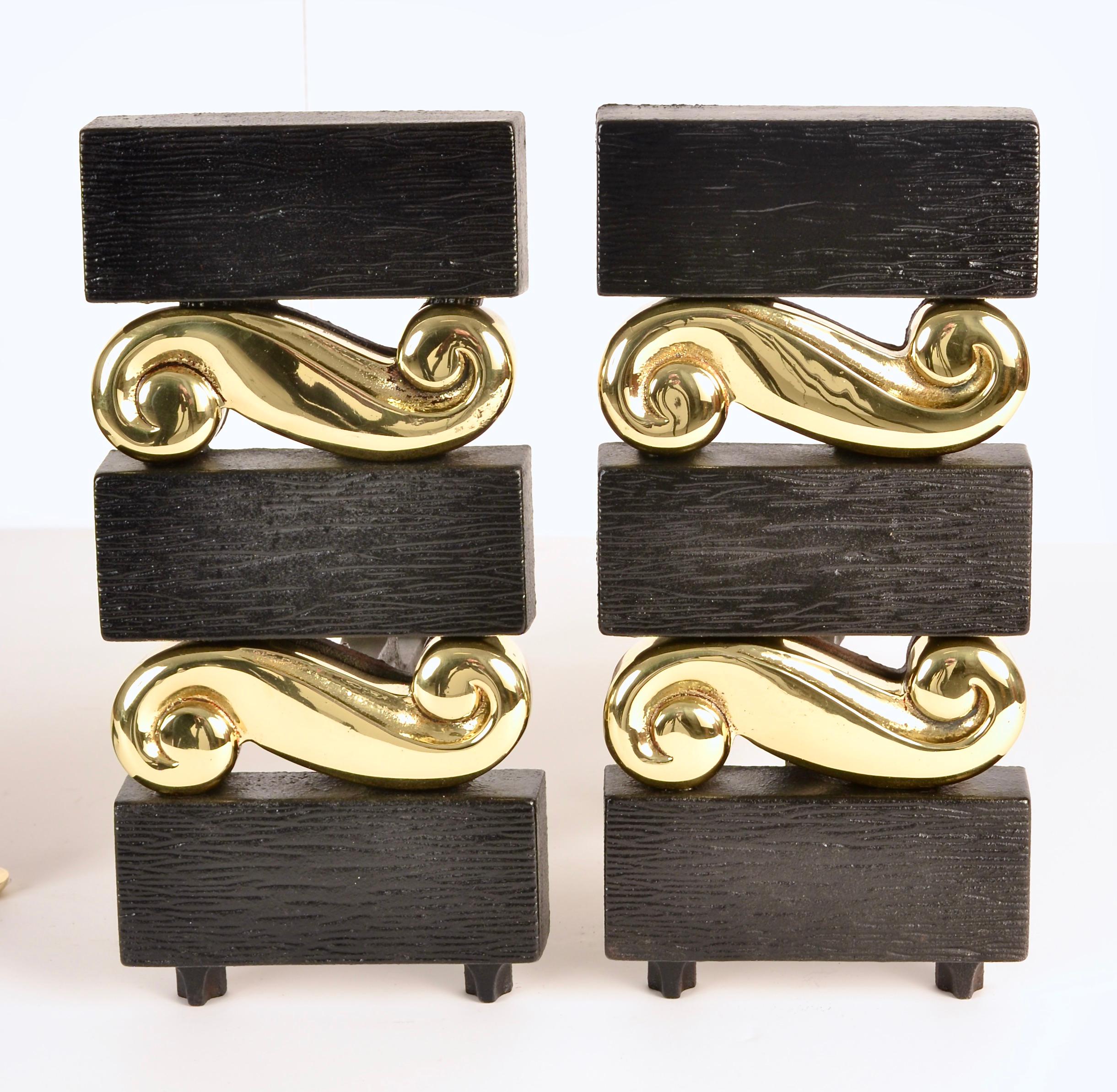 One of the most sophisticated and desirable designs by Donald Deskey, this set features a faux bois pattern on the cast iron, alternating with figured brass decorations. The pieces have been restored to original condition, polished and lacquered