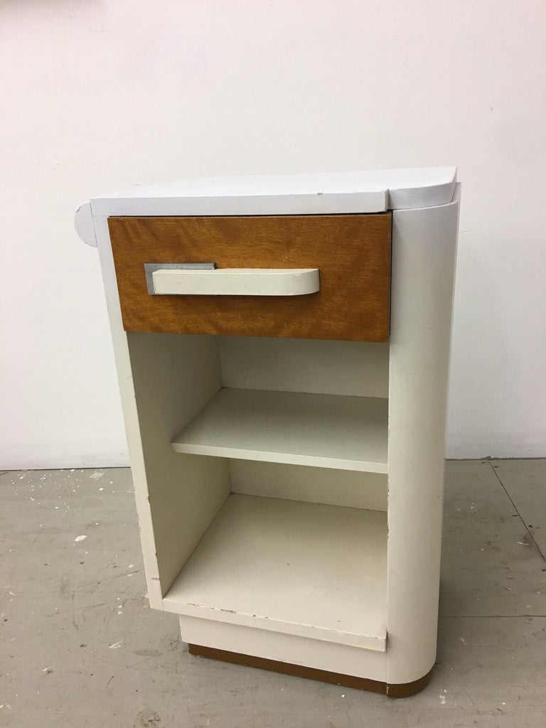 Hard to find nightstand! Donald Deskey for Widdicomb, 1930s. This is the blond wood and cream painted version, white has been repainted. Entire nightstand needs to be refinished. Very solid with no veneer damage! Turn your single into a Classic pair!