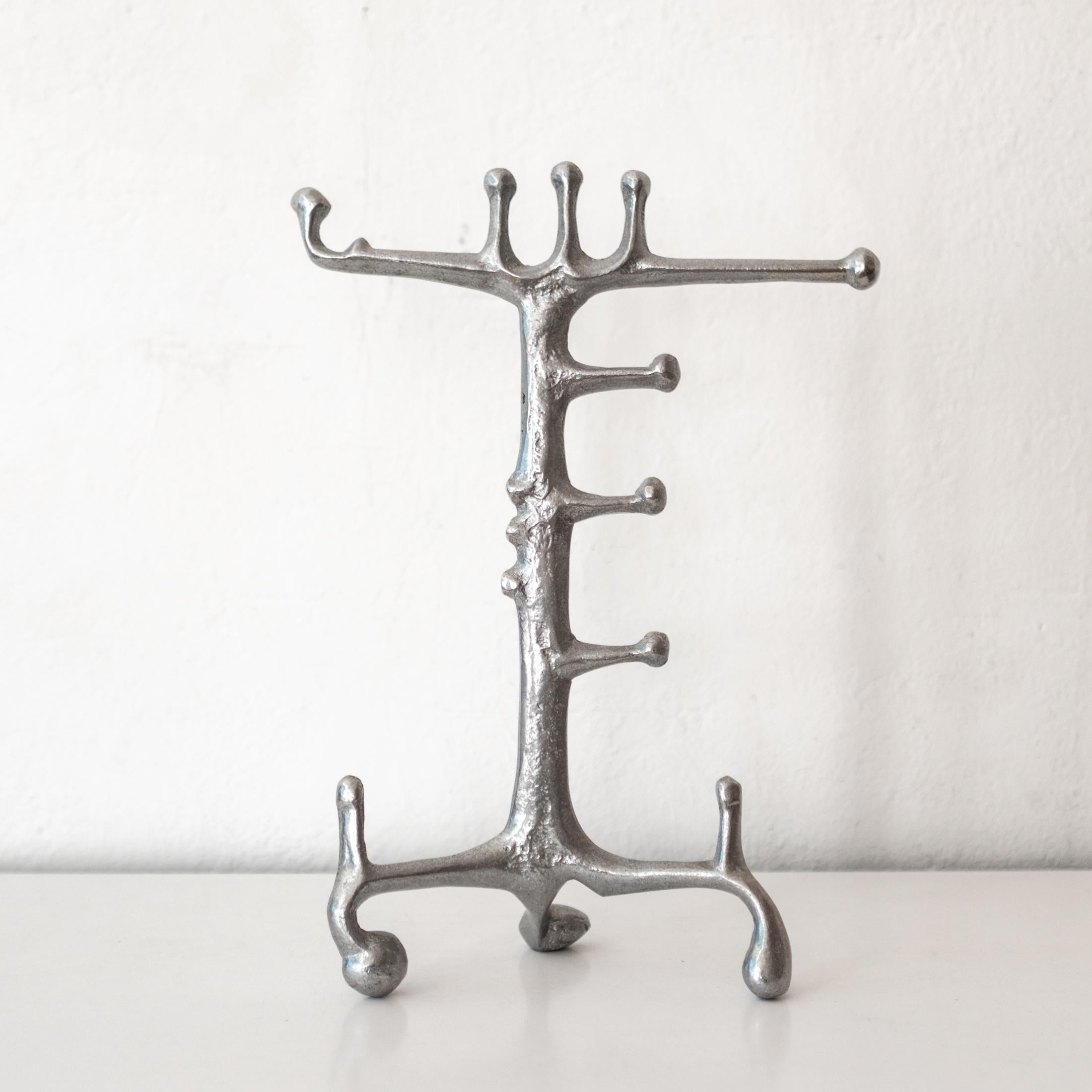 Organic aluminum sculptural jewelry stand by American artist, Donald Drumm.