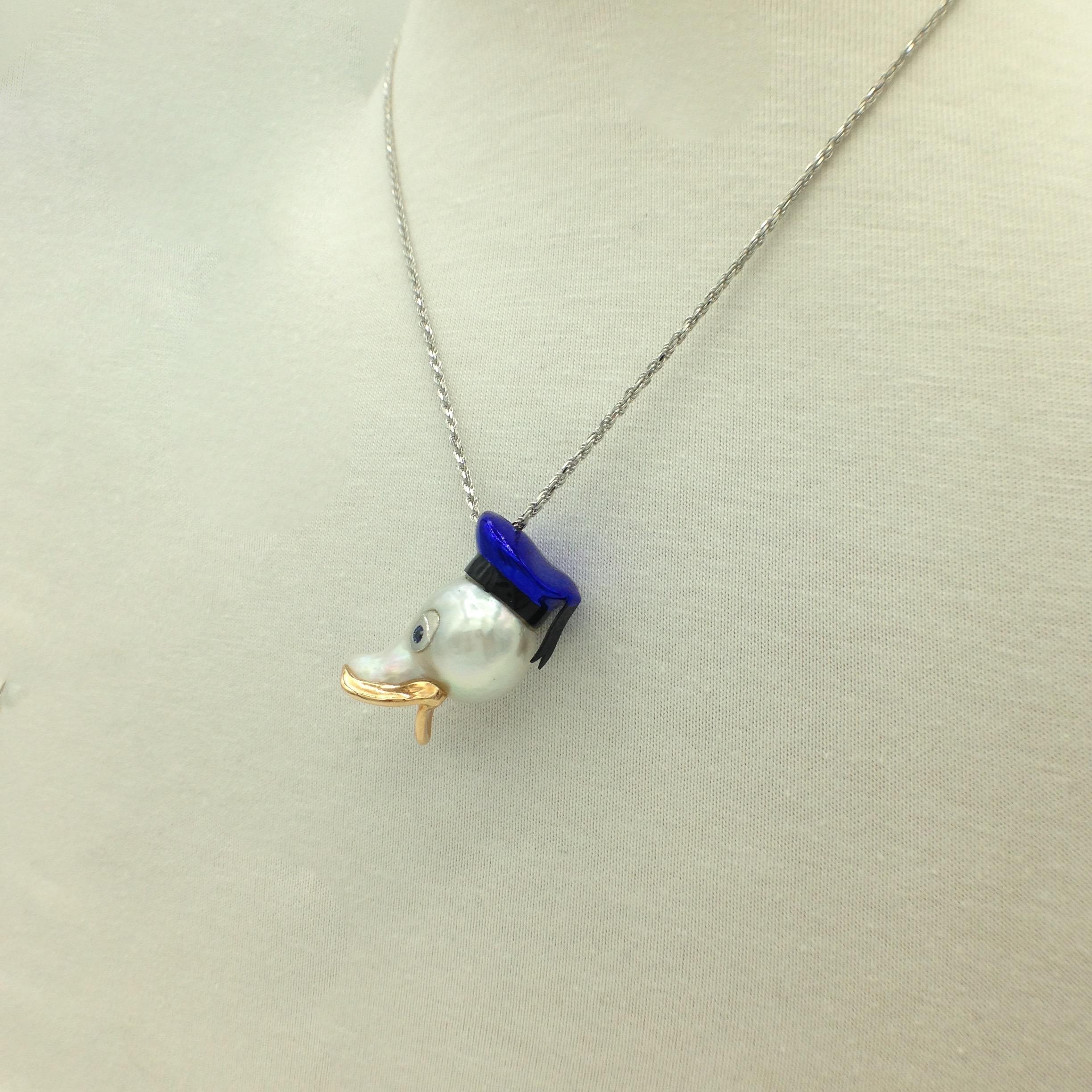 I use a really big and beautiful baroque Australian pearl to create a Donald Duck pendant. 
Its eyes are two sapphires, ct 0.08 in total.
Its hat is in white 18Kt gold with a special galvanic treatment, in two colors: blue and black.
the beak is in