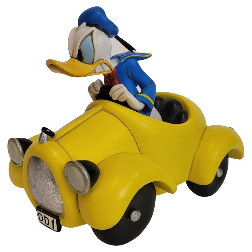 Donald Duck driving his yellow DD1 cabriolet