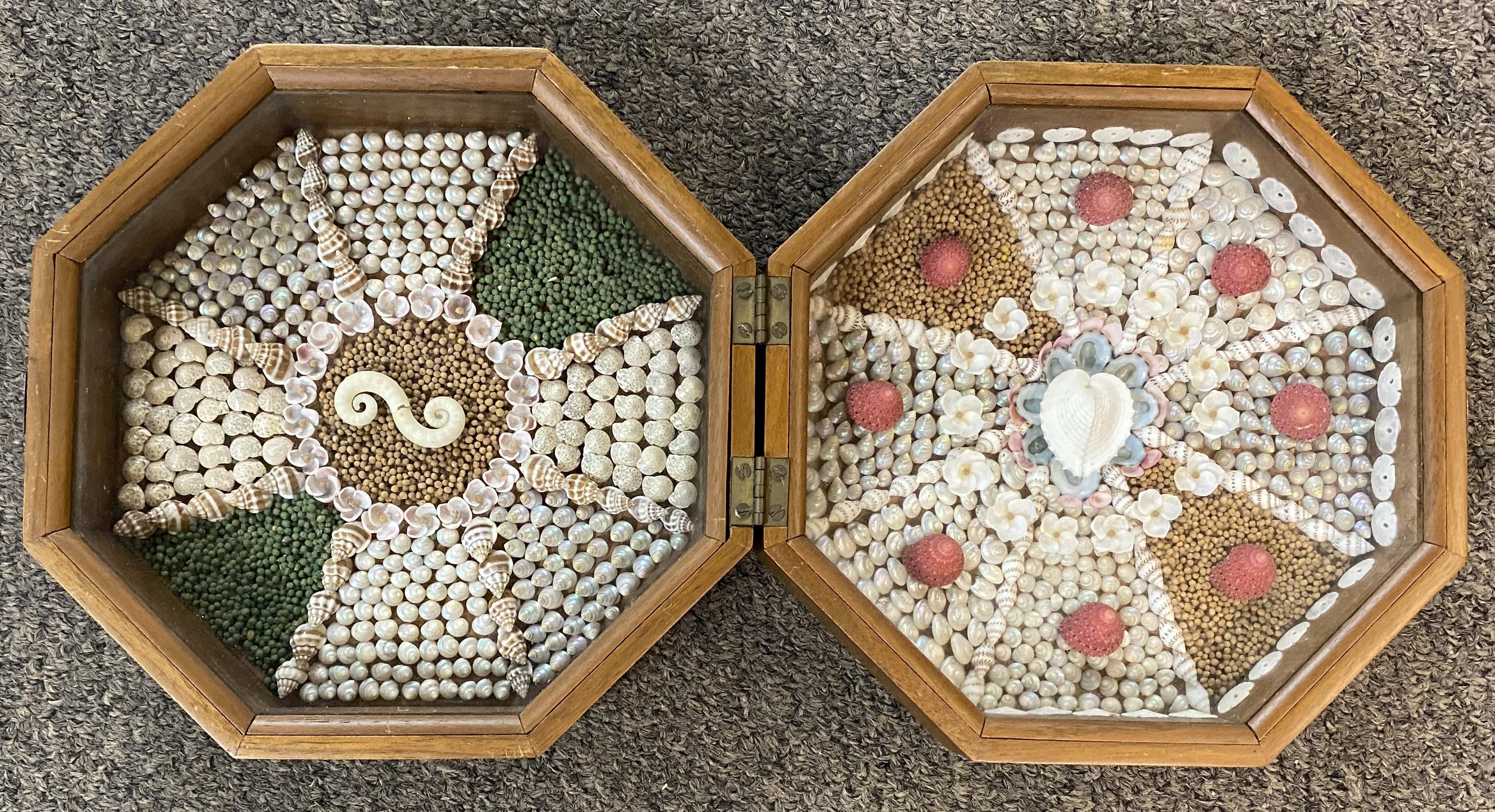 A beautiful sailor’s valentine with intricate shellwork under glass, in an octagonal mahogany case with raised shell decoration carved by master cabinetmaker Donald Dunlap of Antrim, New Hampshire, in the tradition of the 18th century Dunlaps.
