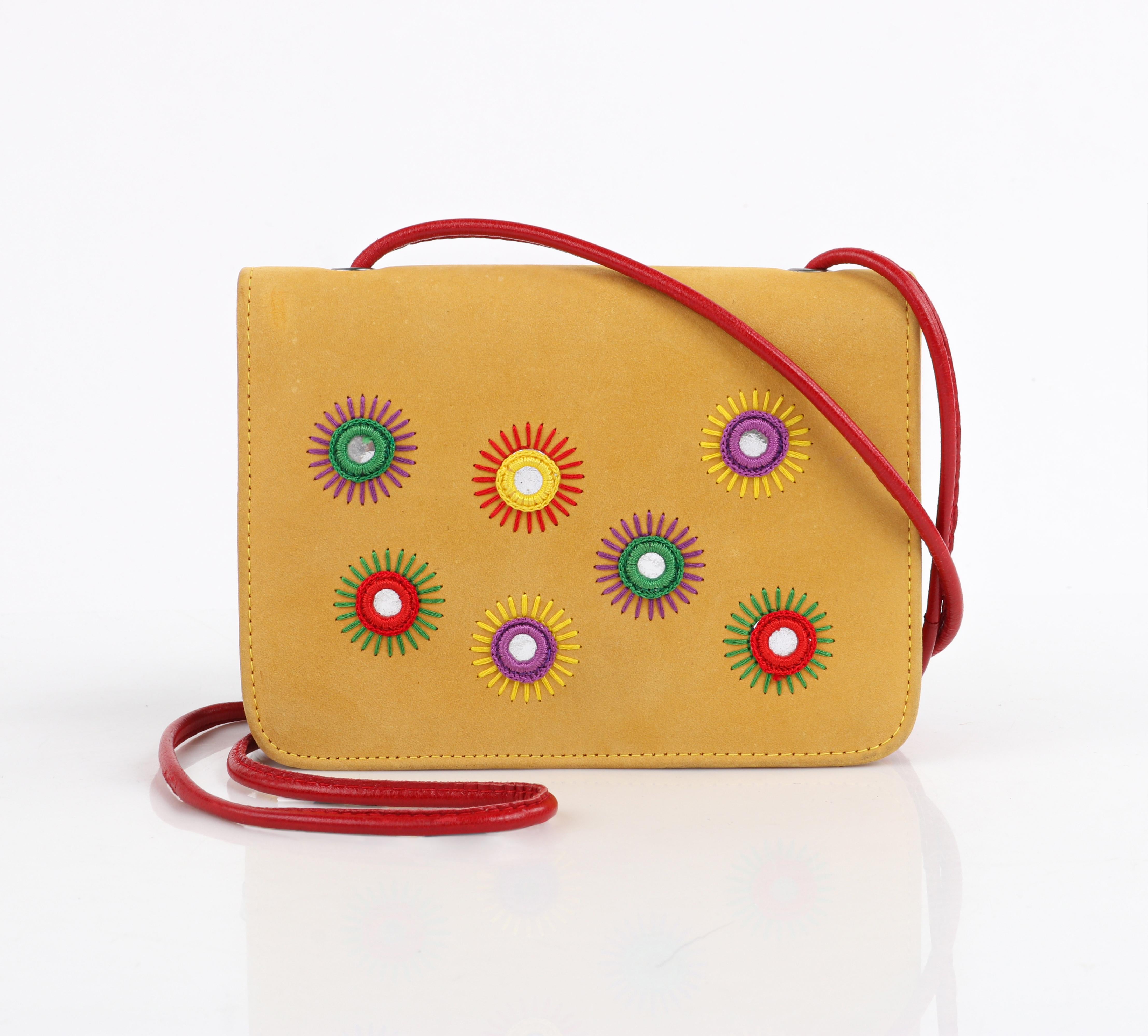 DONALD J PLINER c.1980's/90's Suede Leather Embroidered Crossbody Shoulder Bag

Circa: 1980’s/1990's
Style: Flap shoulder bag
Color(s): Shades of yellow (suede), orange (leather), red (leather strap), stitching: green, purple, red, yellow
Lined: